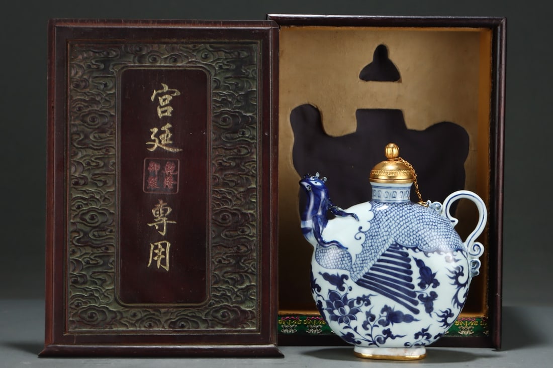 Yuan Dynasty Blue and White Interlocking Lotus Pattern Gilt Chased Phoenix Mouth Flat Pot with Cover: Yuan Blue and White Interlocking Lotus Pattern Gilt Chased Phoenix-Mouth Flat Pot: Porcelain body painted with powerful-toned blue and white interlocking lotus motifs; phoenix-mouth spout and lid deco