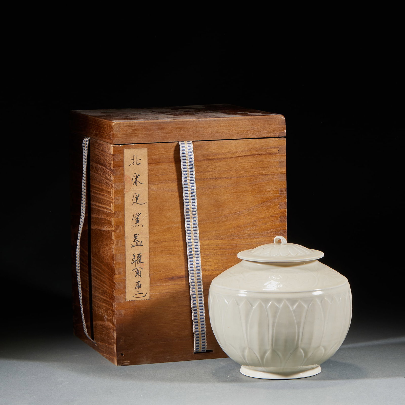 Northern Song Ding Kiln Cover Jar: Northern Song Ding Kiln Lidded Jar: Porcelain with white glaze carved lotus petal patterns, complete lidded design and mild lustrous glaze. Height 15cm, belly diameter 16cm. Premium Northern Song Ding