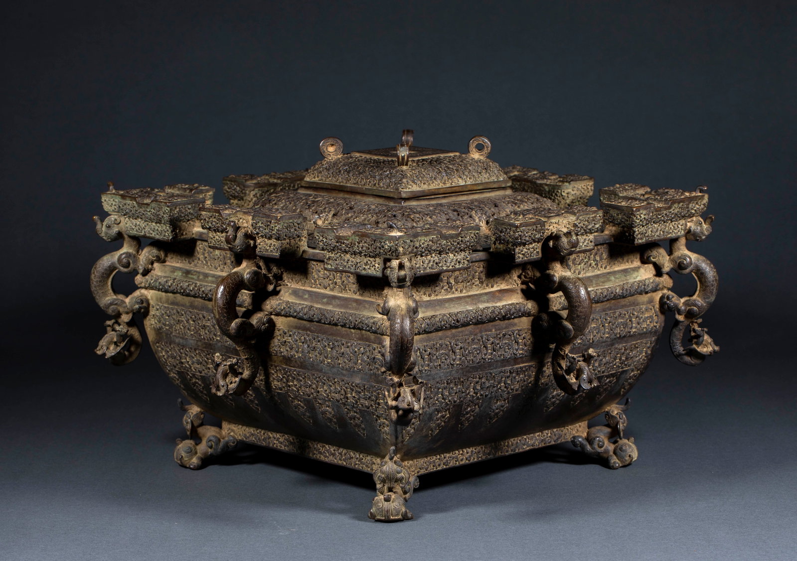 Ancient Chinese Bronze Ice Mirror: Ancient Chinese Bronze Ice Mirror: Cast in bronze adopting hollow out and relief craft, decorated with pan chi dragon patterns and cloud thunder patterns, square shape matched with dragon-shaped ears 