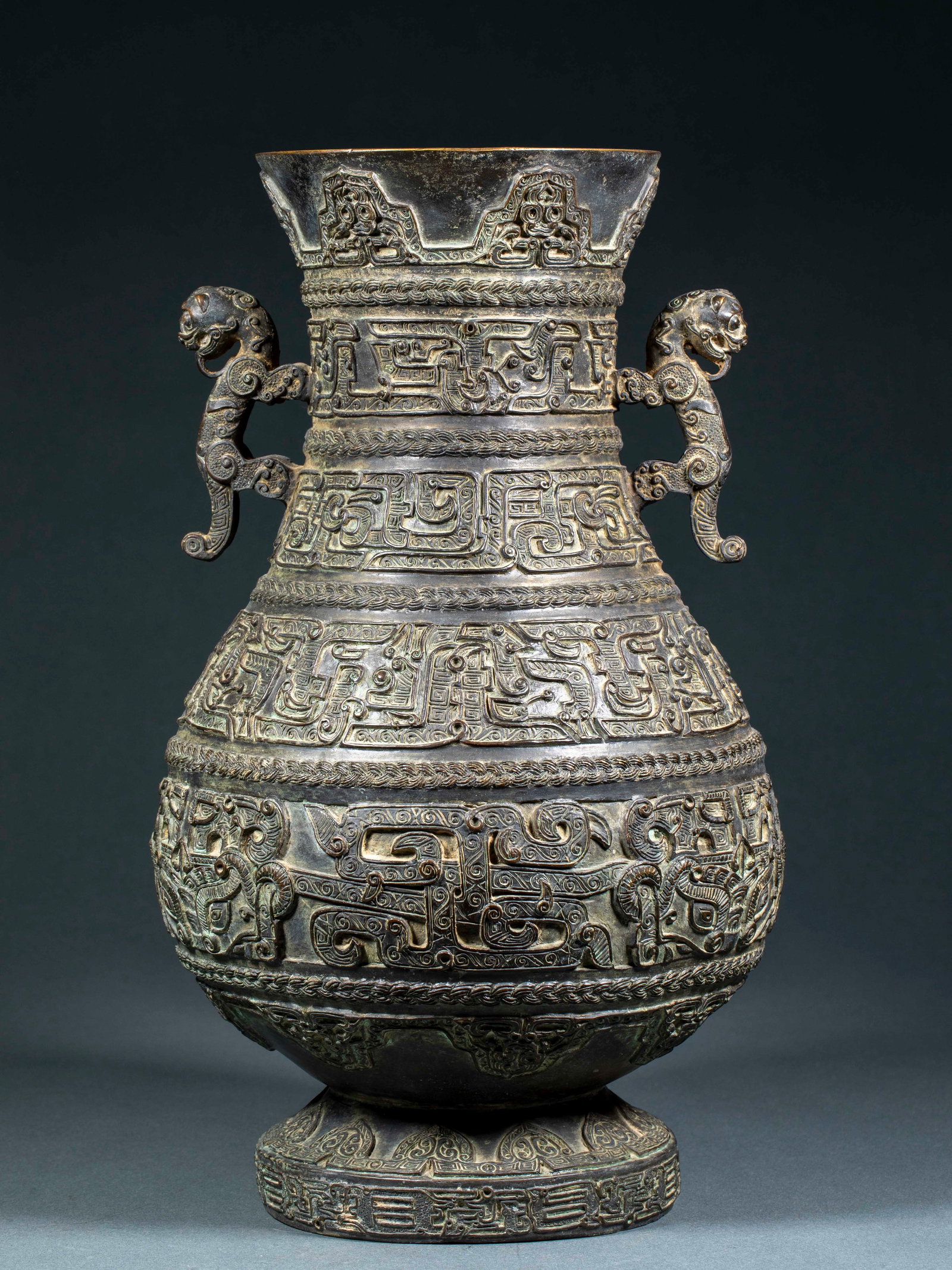 Pre-Ming Bronze Rope Pattern Dragon Pot: Pre-Ming Bronze Rope-Pattern Dragon Pot: Cast in bronze with relief and line carving techniques, decorated with rope patterns and dragon patterns all over the body featuring fluent lines, thick