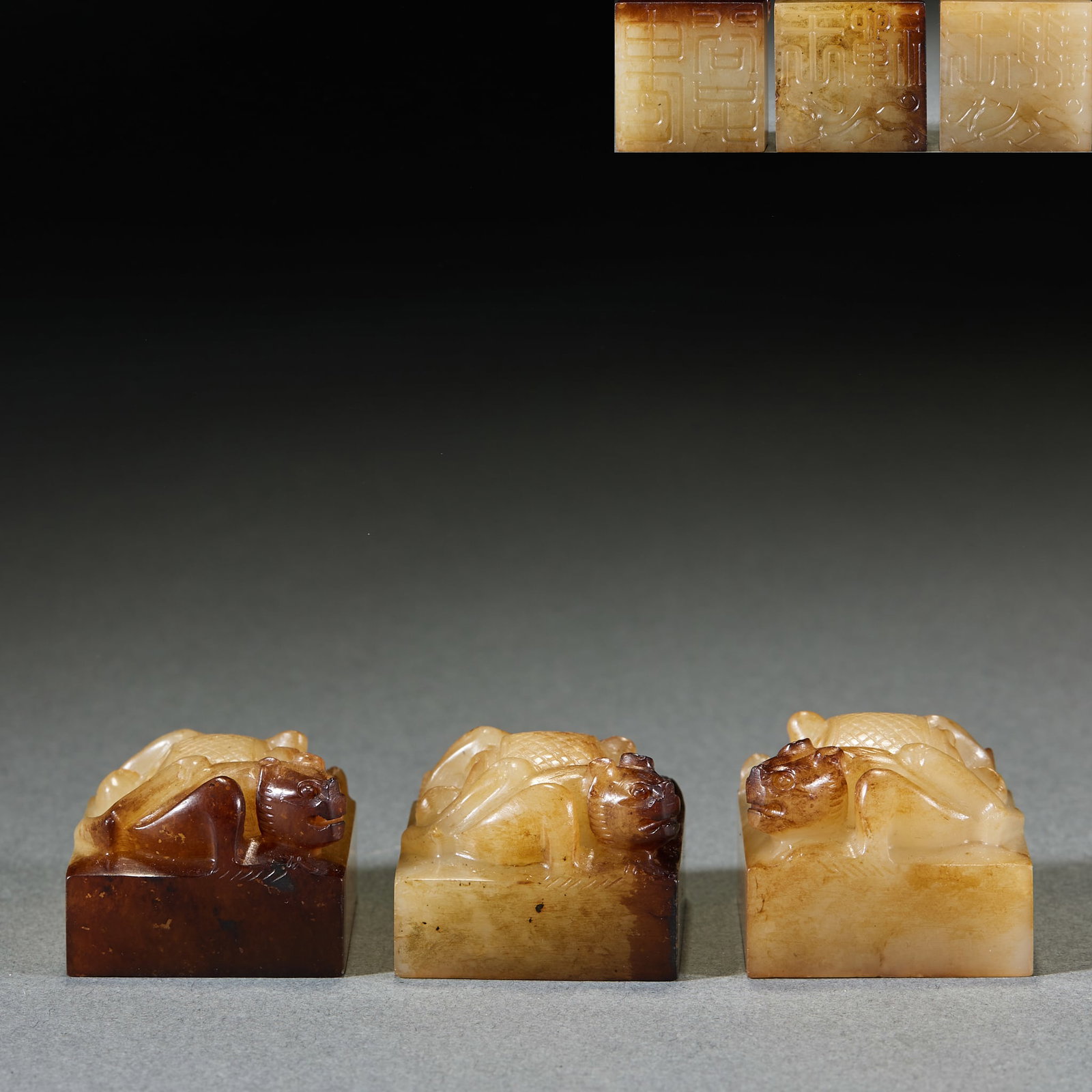 Pre-Ming Ancient Jade Seal Set, Three Pieces: Set of Pre-Ming High Ancient Jade Seals: Made of Hetian jade with natural mottling, carved with chilong tiger knobs and ancient seal script on the face, complete with three pieces in one set; Height 2