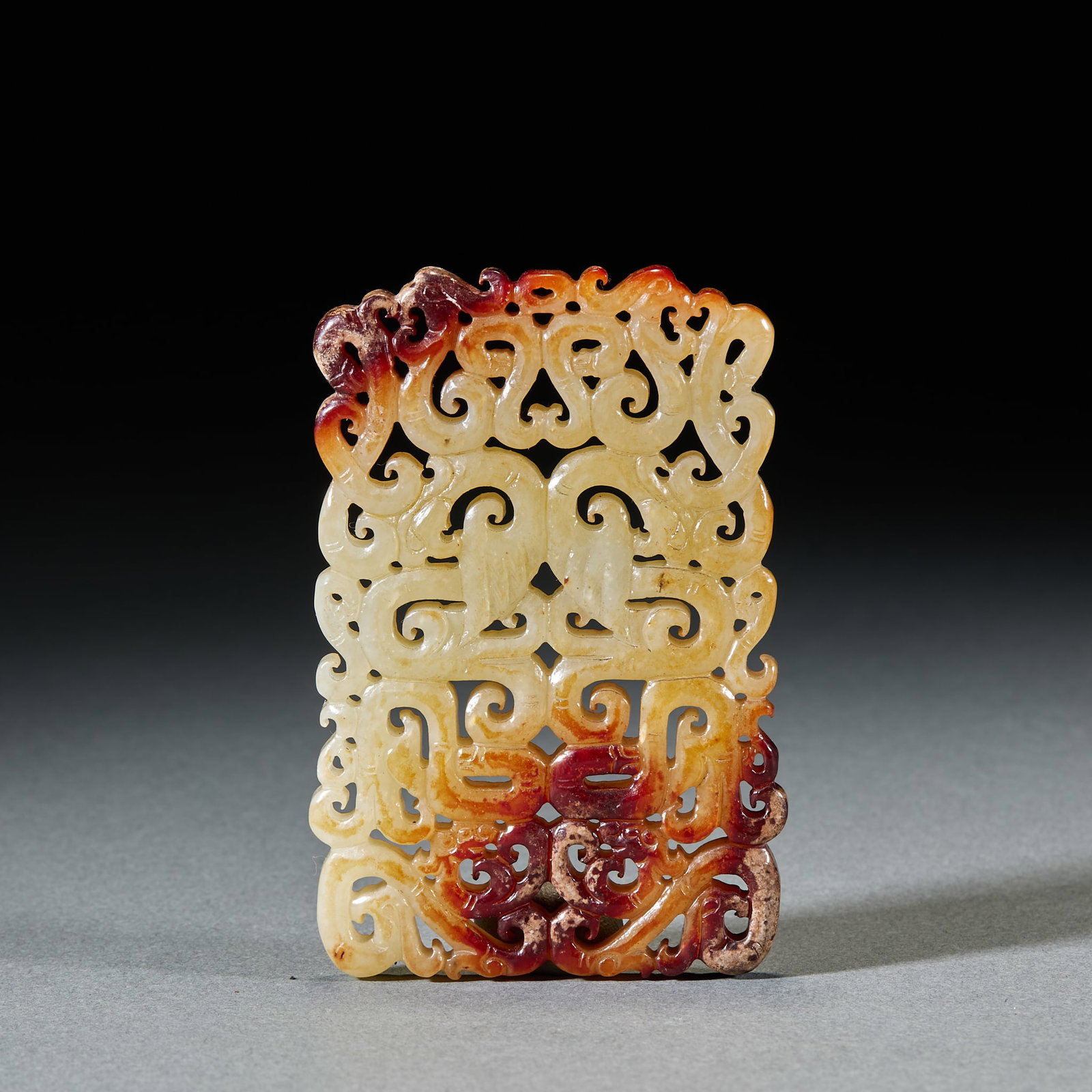 Hetian Jade Dragon and Phoenix Pattern Pendant: Hetian Jade Dragon and Phoenix Pattern Pendant: Made of white Hetian jade with red natural mottling, openwork carved with dragon and phoenix patterns featuring exquisite ornamentation; Length 8.3cm, w