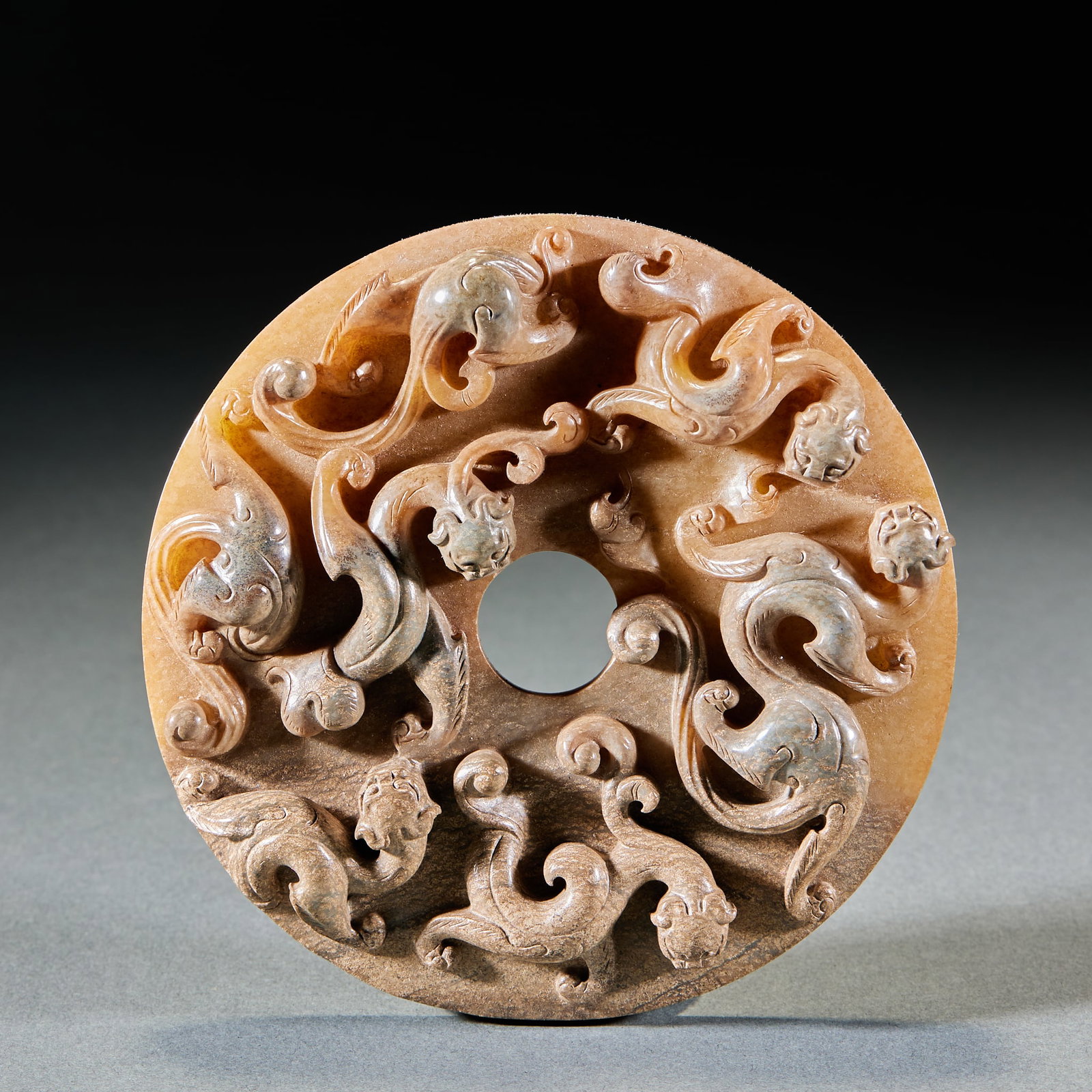 Han Dynasty Relief Multi-Chilong Protruding Jade Bi Disc: Han Dynasty Relief Multi-Chilong Outlined Jade Bi: Made of Hetian jade fully decorated with relief multi-chilong patterns, mild jade texture and thick patina; Height 2cm, diameter 11.4cm, weight 283g;