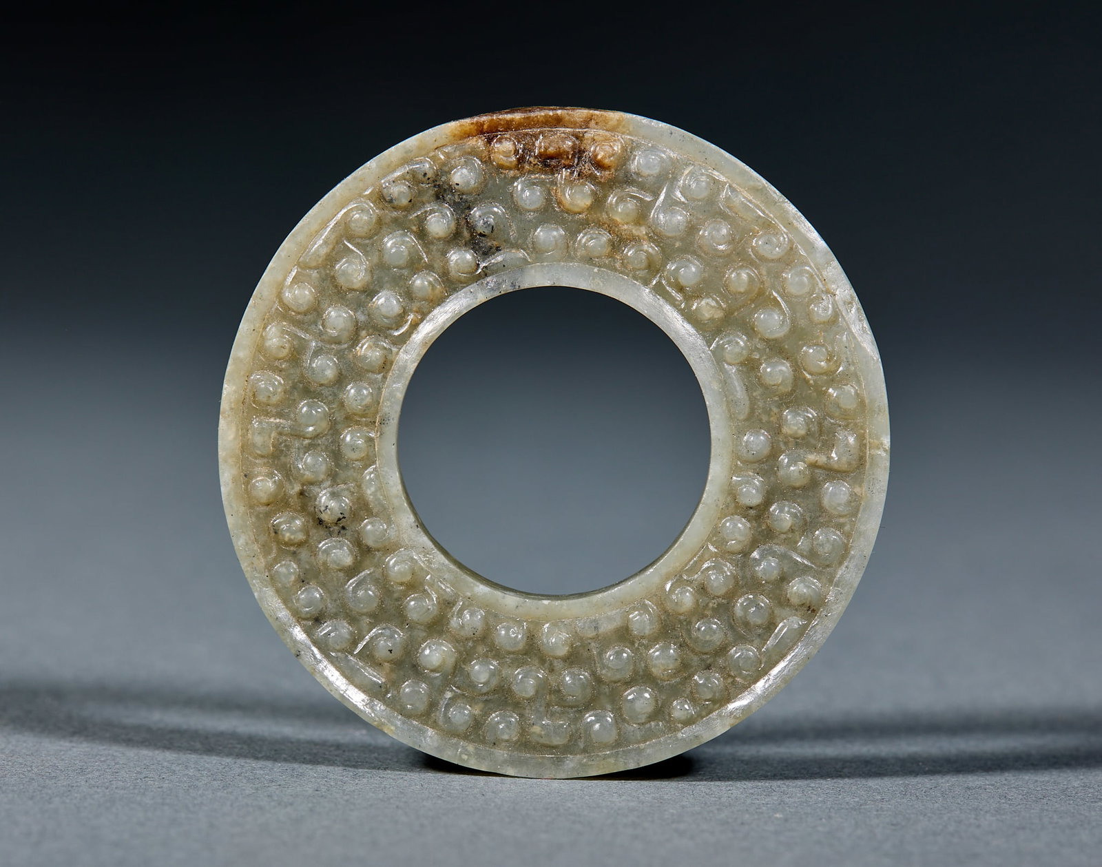 Archaic Jade Bi Disc: High Ancient Jade Bi: Made of Hetian jade with natural mottling, plain or shallow carved patterns and regular shape; Diameter 5.7cm, weight 28g; An ancient ritual jade ware with fine jade texture,