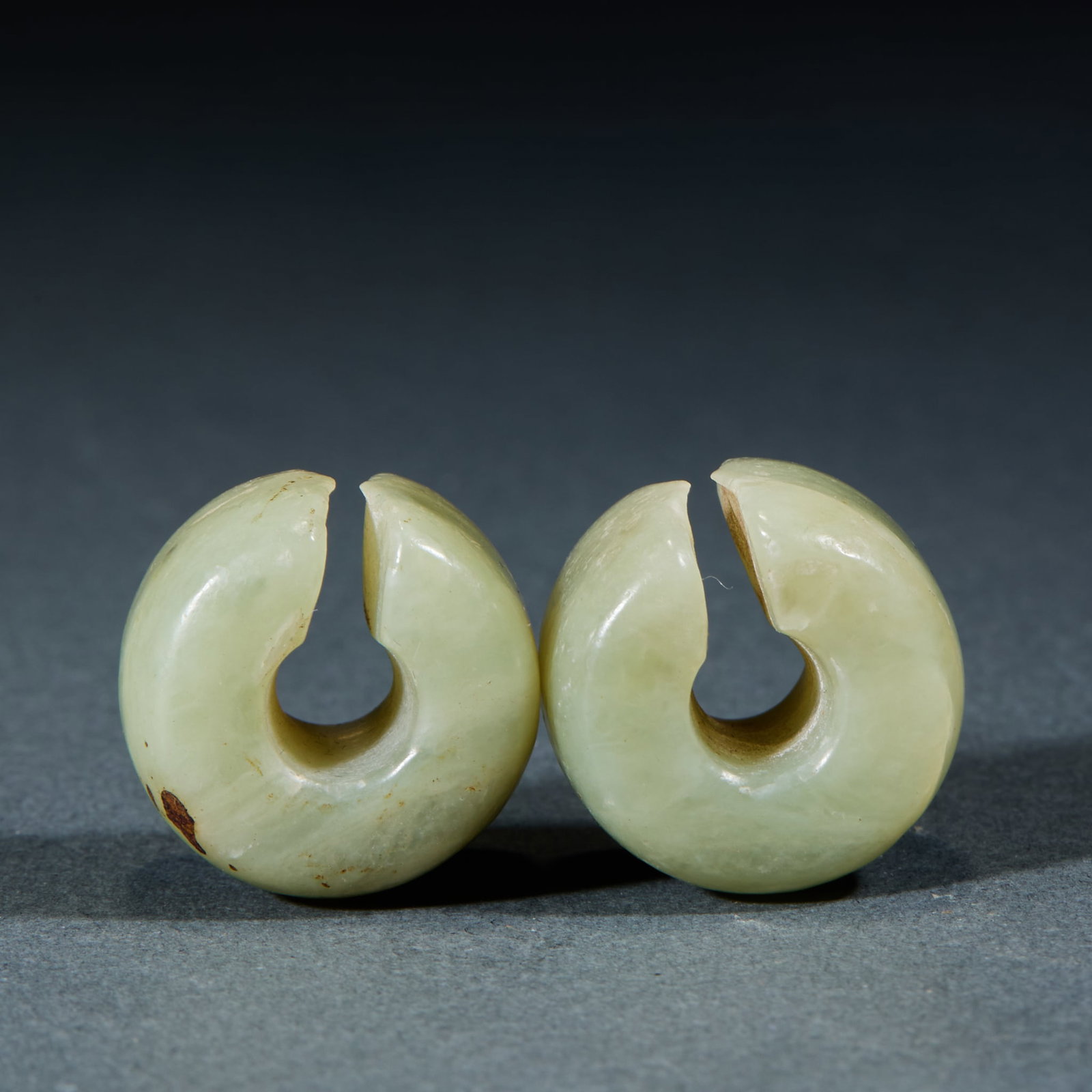 Hongshan Jade Jue, A Pair: Pair of Hongshan Culture Jade Jue: Made of jade with natural mottling, ring-shaped with notch, small regular shape preserved as an intact pair; Length 2.1cm, width 1.5cm, weight 22g; Prehistoric jade 