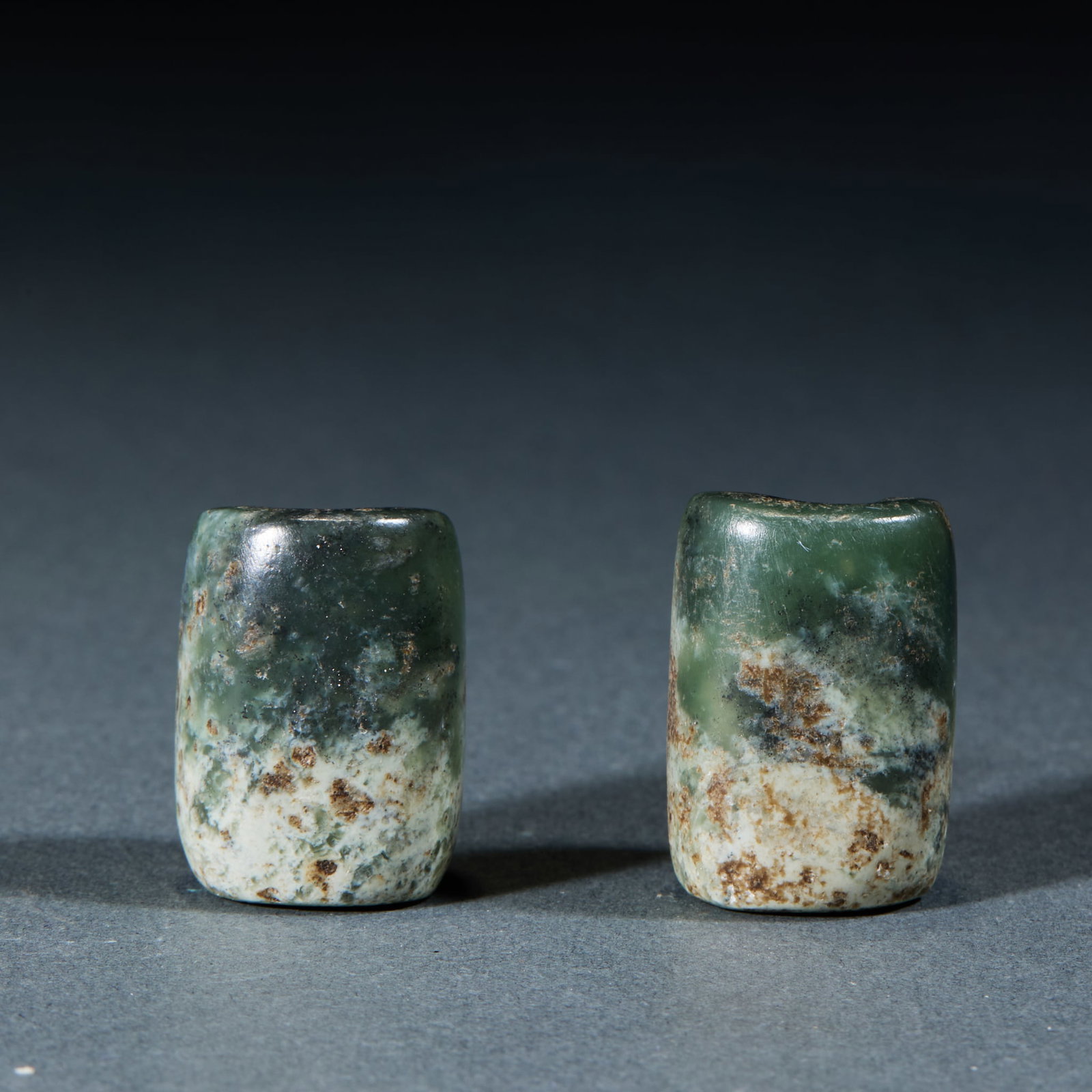 Hongshan Jade Lezi: Hongshan Culture Jade Lezi: Made of jade with natural mottling, regular column shape and mild texture; Length 2.5cm, width 1.7cm, weight 23g; An ancient jade accessory component with concise craft