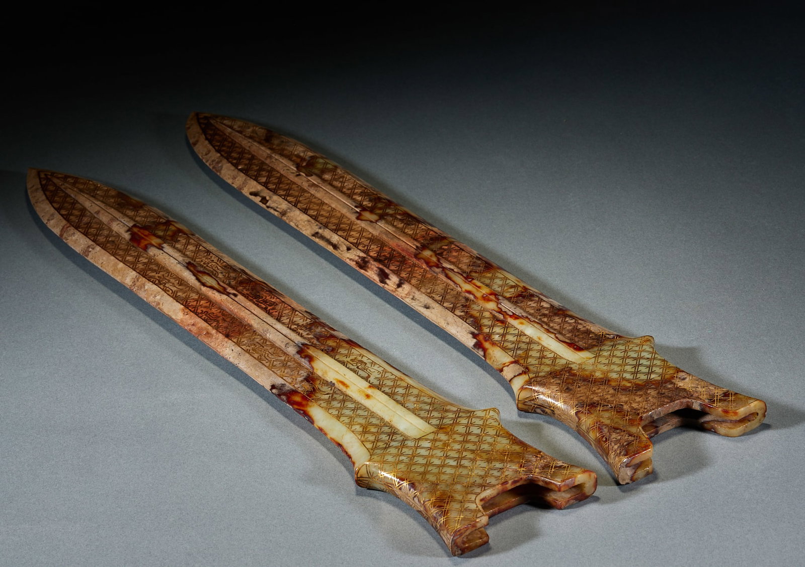 Archaic Jade Sword Sheath, A Pair: Pair of High Ancient Jade Sword Sheaths: Made of jade with natural mottling, surface decorated with gold inlaid patterns and regular shape; Length 46cm, width 9cm; Ancient weapon accessories with