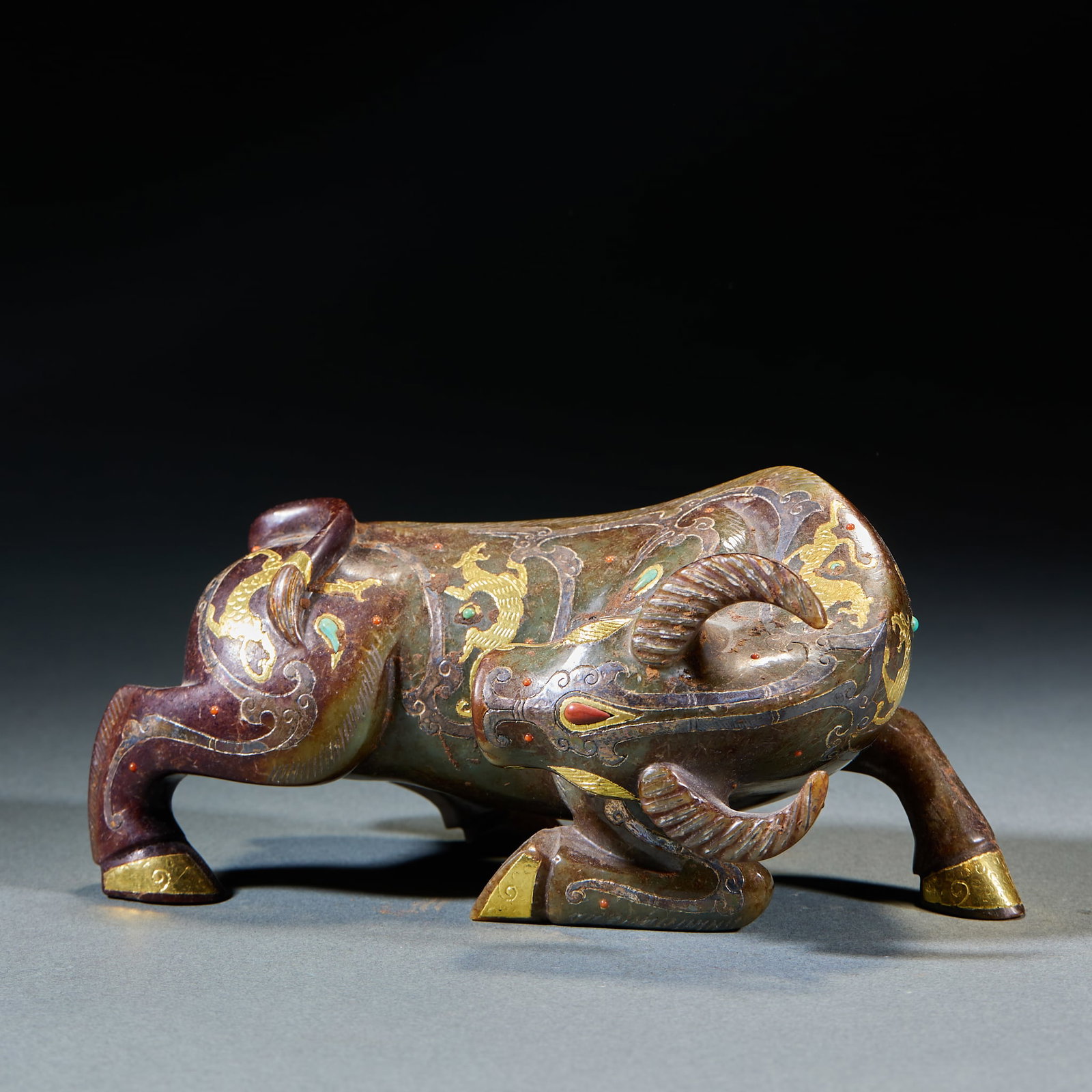 Gold Inlaid Jade Ox Ornament: Gold-Inlaid Jade Ox Ornament: Made of jade decorated with gold inlay and gemstone patterns, designed in realistic large ox shape; Height 7.5cm, length 17cm, width 9cm, weight 1089g; A grand ancient