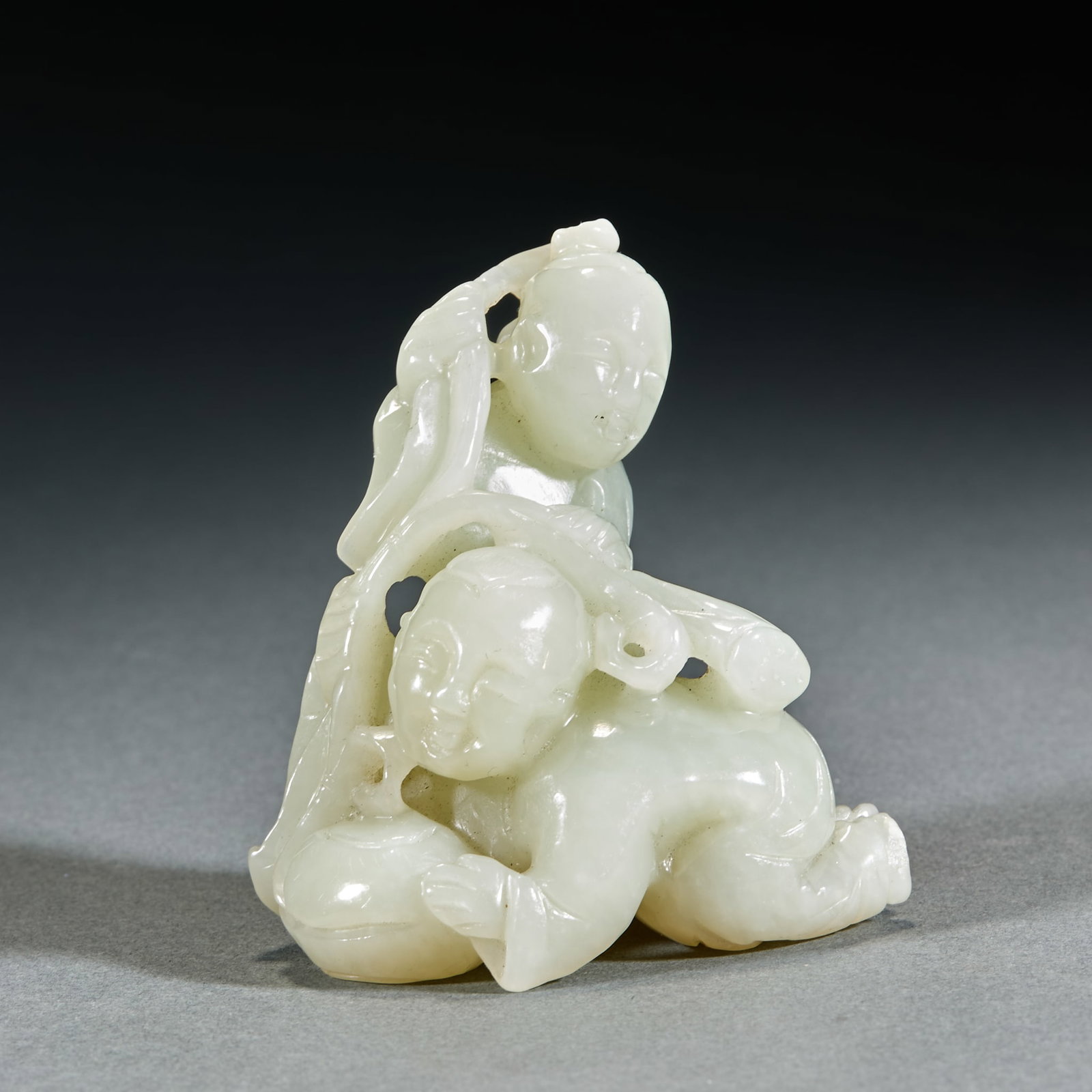 Qing Dynasty Hetian Jade Boy Holding Lotus Ornament: Qing Dynasty Hetian Jade Boy Holding Lotus Ornament: Made of white jade carved with an innocent boy holding lotus implying good fortune; Height 7cm, length 7cm, width 4cm, weight 179g; Mild jade
