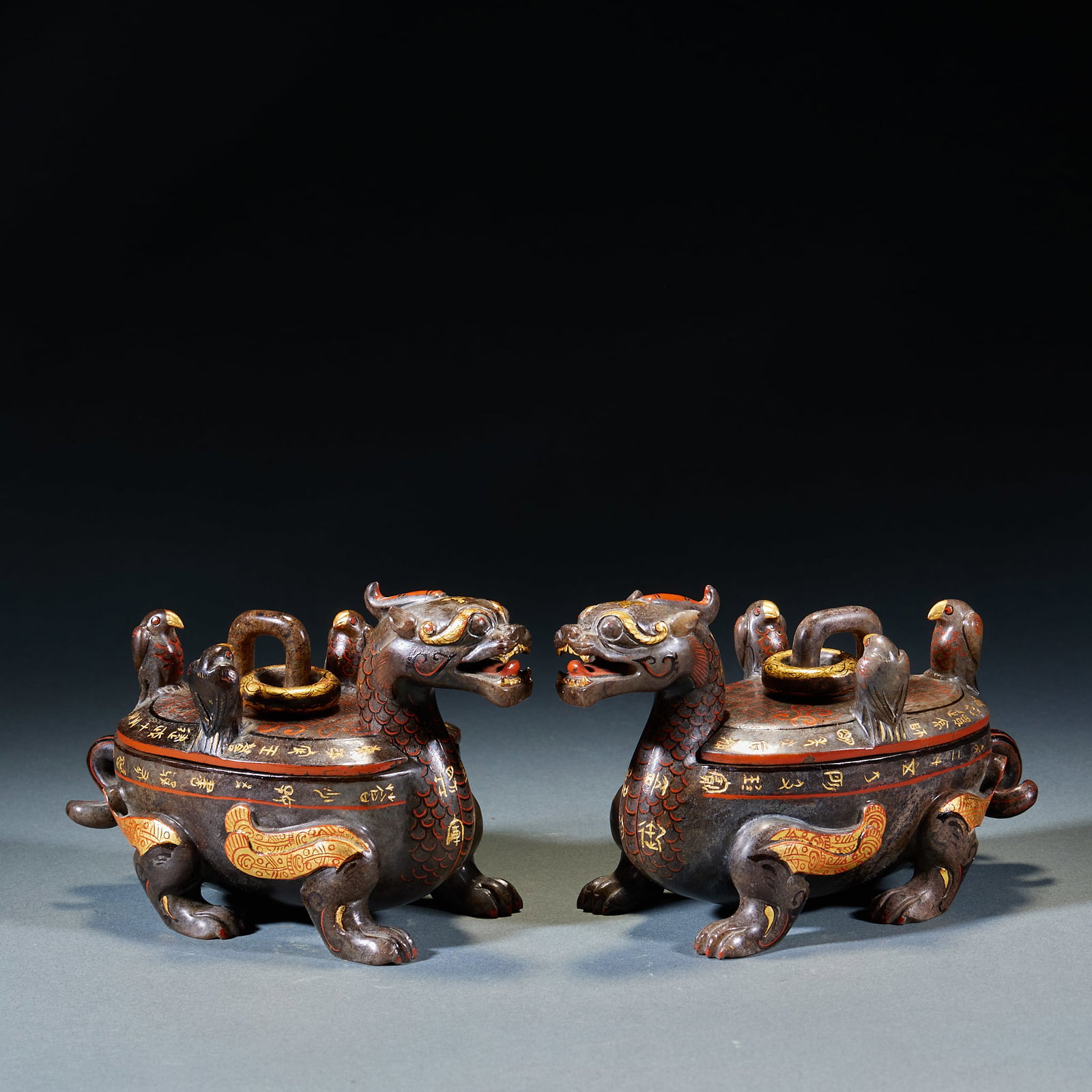 Gold Inlaid Painted Jade Beast, A Pair: Pair of Gold-Inlaid Painted Jade Mythical Beast Zun: Made of jade decorated with gold inlay and colored painting, carved into mythical beast shaped ritual vessel; Height 11cm, length 16cm, width 8cm;