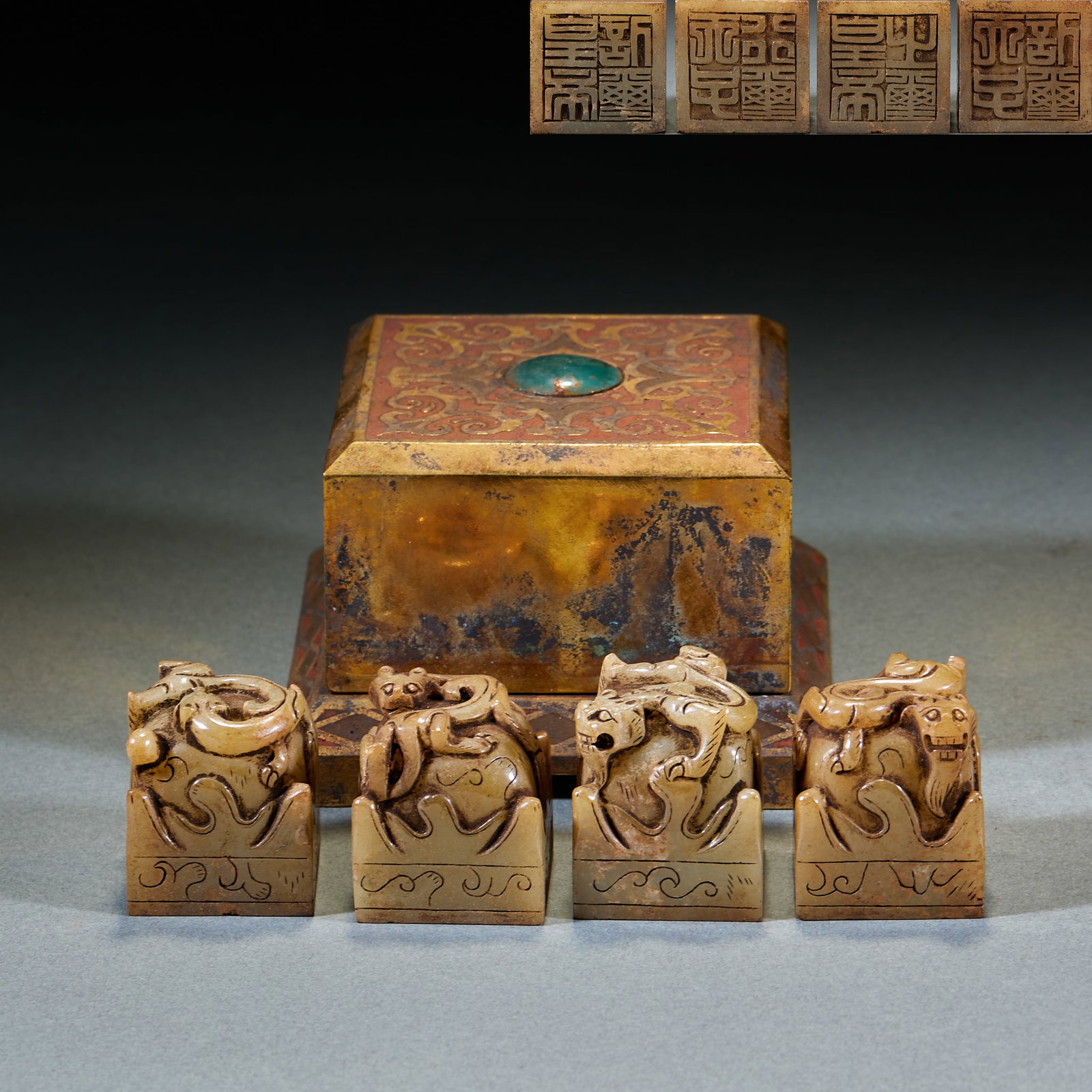 Gilt Bronze Chilong Pattern Jade Seal Set, Four Pieces: Set of Gilt Copper Chilong Pattern Jade Seals: Jade seal body with gilt copper seal box, seal knob carved with chilong, total four pieces; Height 3.5cm, length 3cm, width 3cm; Luxurious craft and
