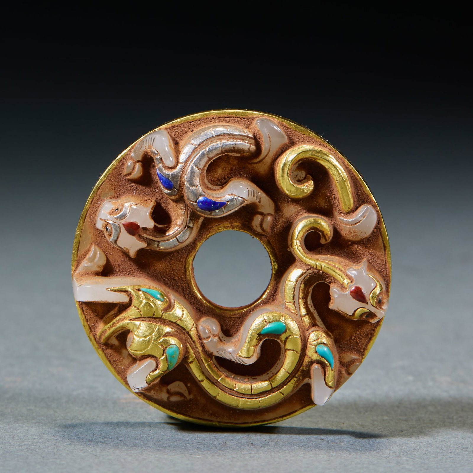 Gold and Silver Inlaid Chilong Jade Bi Disc: Gold-Silver Inlaid Gem Chilong Jade Bi: Made of jade adopting gold-inlaid jade craft embedded with gold-silver wires and gemstones, decorated with double chilong patterns; Height 1cm, diameter 5cm,