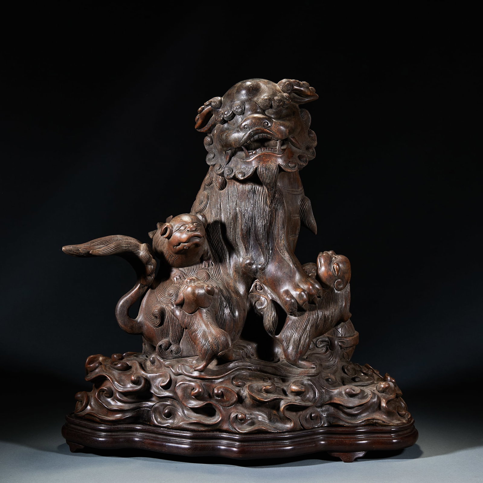 Agarwood Grand Tutor and Junior Tutor Ornament: Agarwood Grand and Junior Lion Ornament: Fully carved from natural high-quality agarwood adopting relief and round carving techniques, depicting grand lion and junior lion playing scenes with fine