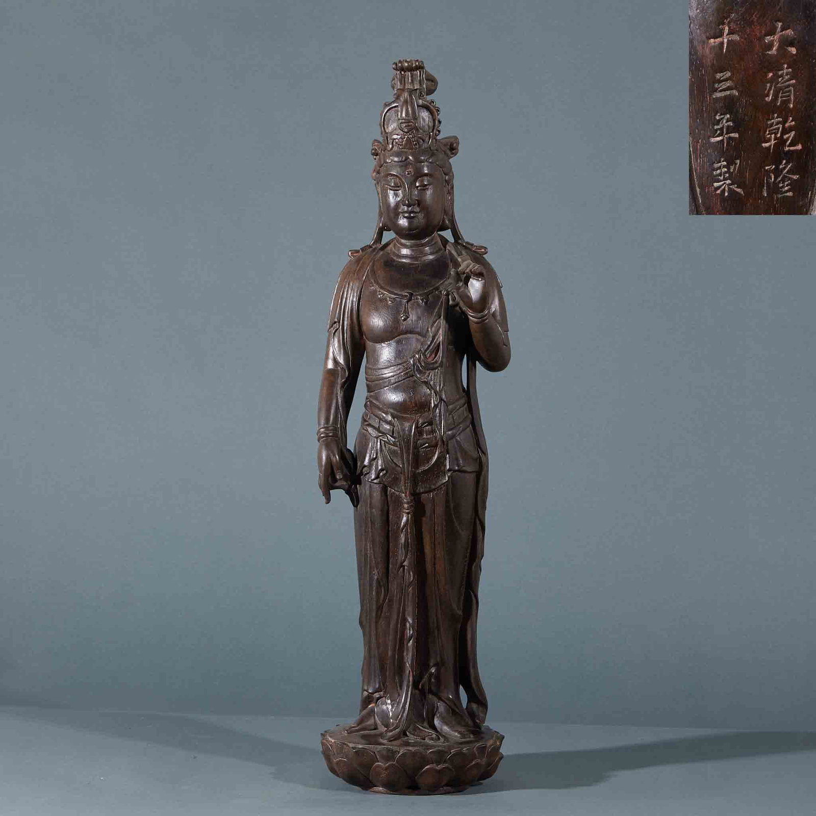 Thirteenth Year of Qianlong Agarwood Standing Guanyin Statue: Qing Qianlong Thirteenth Year Agarwood Guanyin Standing Statue: Carved from agarwood into standing Guanyin with lotus base; Height 66cm, length 17cm, width 15cm, weight 1251g; Mild wood texture and