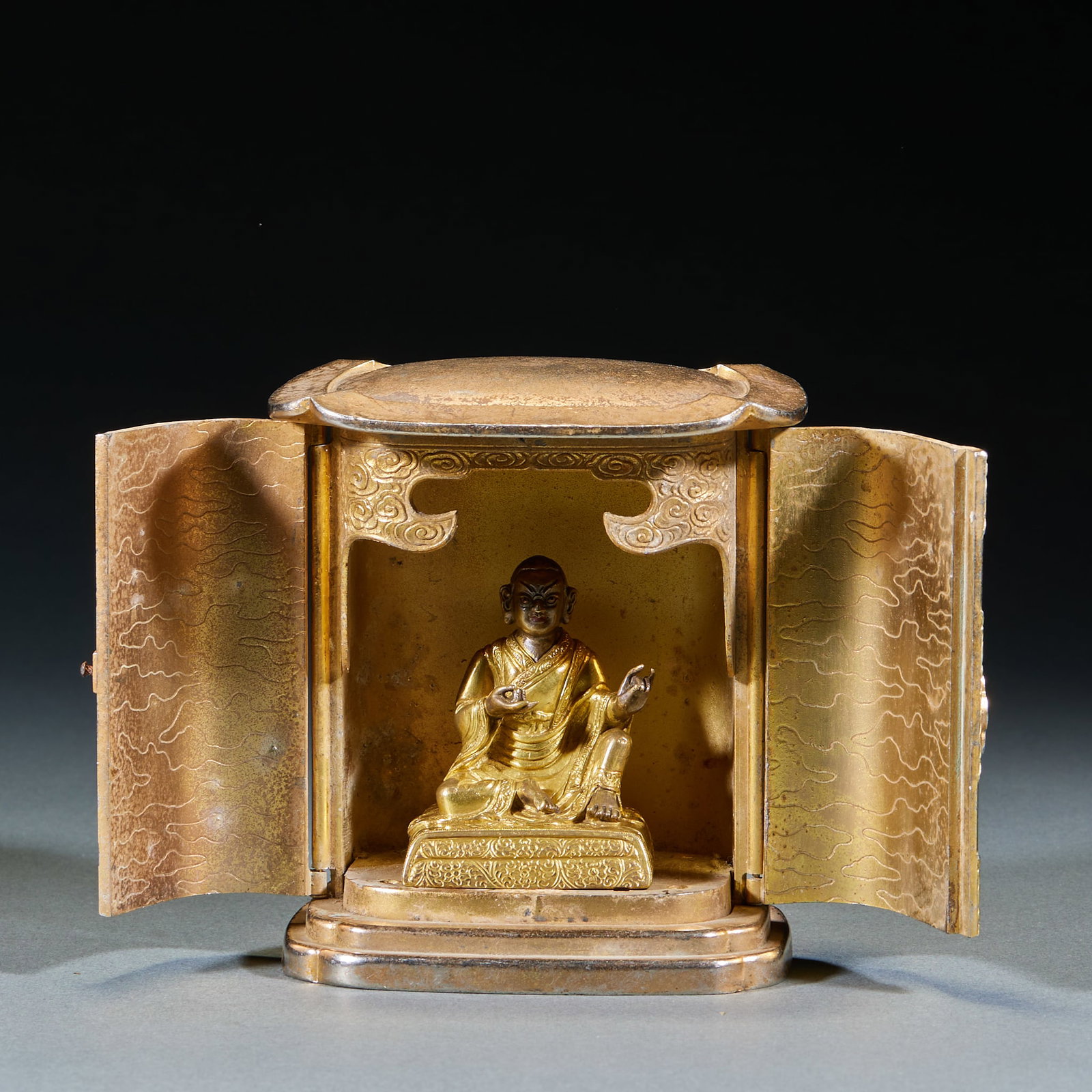 Gilt Bronze Lama Buddha with Niche: Gilt Copper Guru Buddha Statue with Niche: Gilt copper Buddha statue matched with wooden Buddhist niche; Buddha Height 6cm, length 5cm, width 3.5cm; Exquisite statue shape and elaborate niche craft