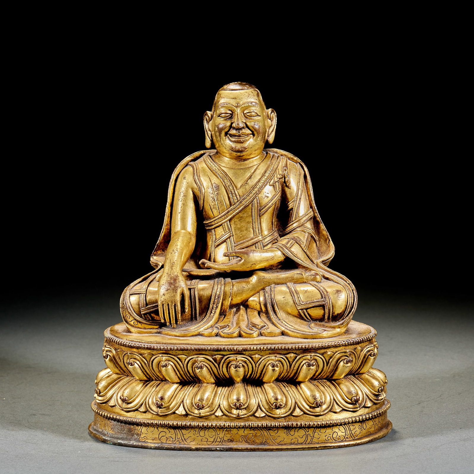 Gilt Bronze Lama Buddha: Gilt Copper Guru Buddha Sitting Statue: Gilt copper Buddha statue on lotus throne; Height 22cm, length 19cm, width 13.5cm; Exquisite craft and vivid image are fine Qing Dynasty Tibetan Buddhist statue