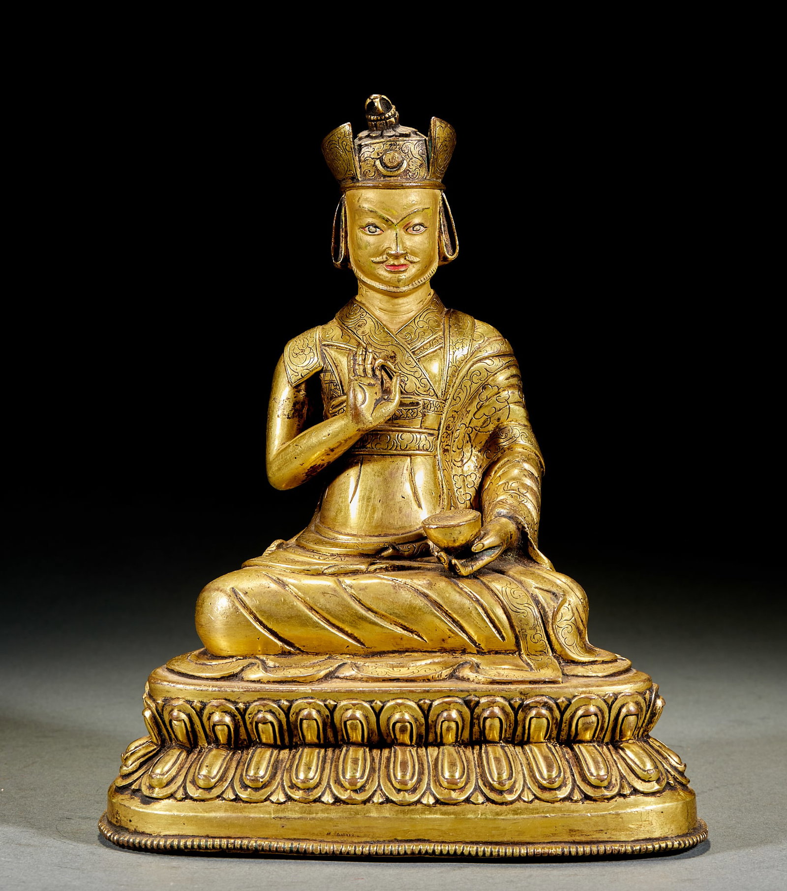 Gilt Bronze Padmasambhava Statue: Gilt Copper Padmasambhava Sitting Statue: Gilt copper Buddha statue on lotus throne; Height 24.5cm, length 19cm, width 13.5cm; Dignified statue shape and fluent robe lines rank it as a top-grade Tibet