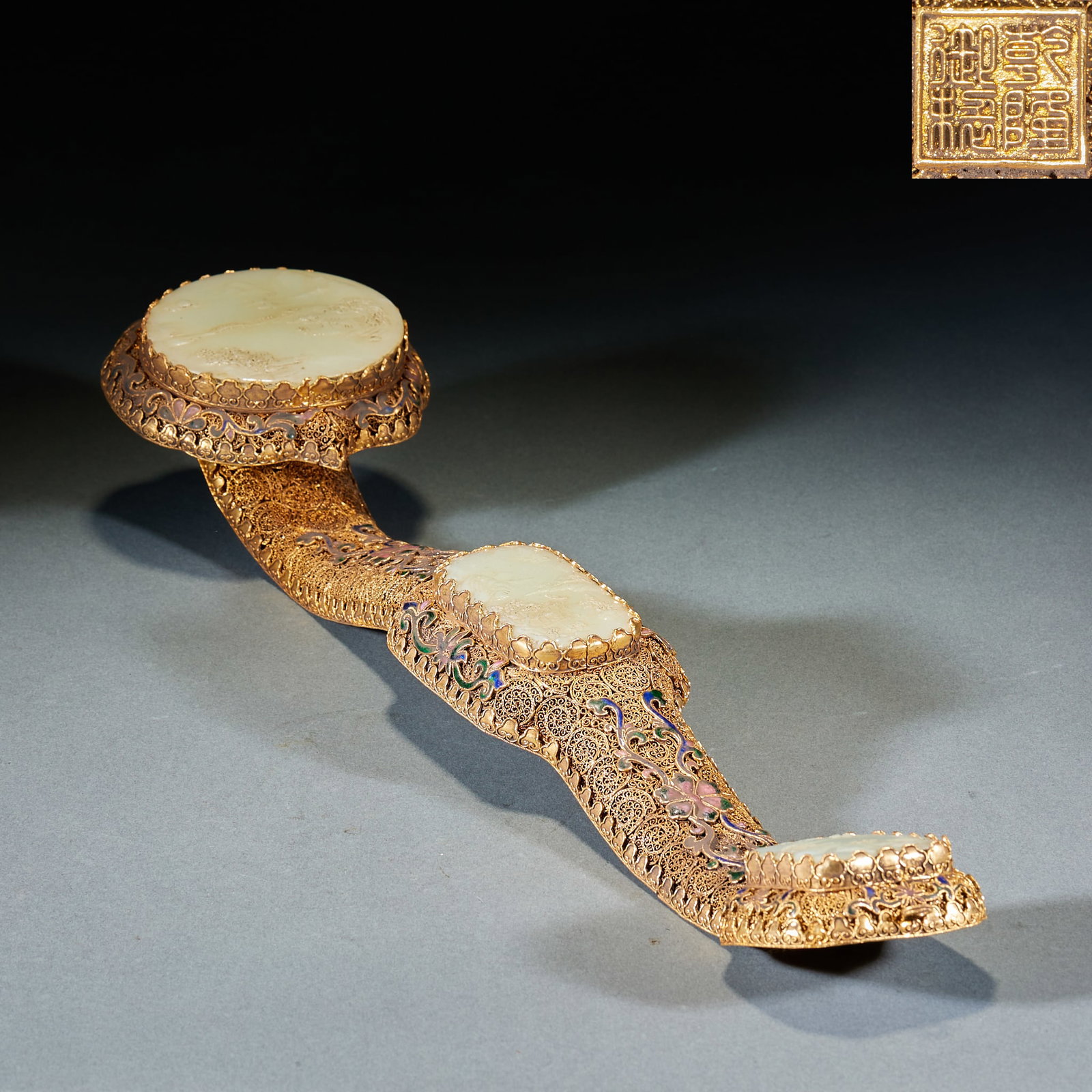 Gilt Bronze Jade Inlaid Landscape Story Ruyi Scepter: Gilt Copper Jade-Inlaid Landscape Pattern Ruyi: Main body of gilt copper inlaid with Hetian jade carved landscape and figure stories, inscribed with "Qianlong Imperial Made" mark; Length 46cm, width 1
