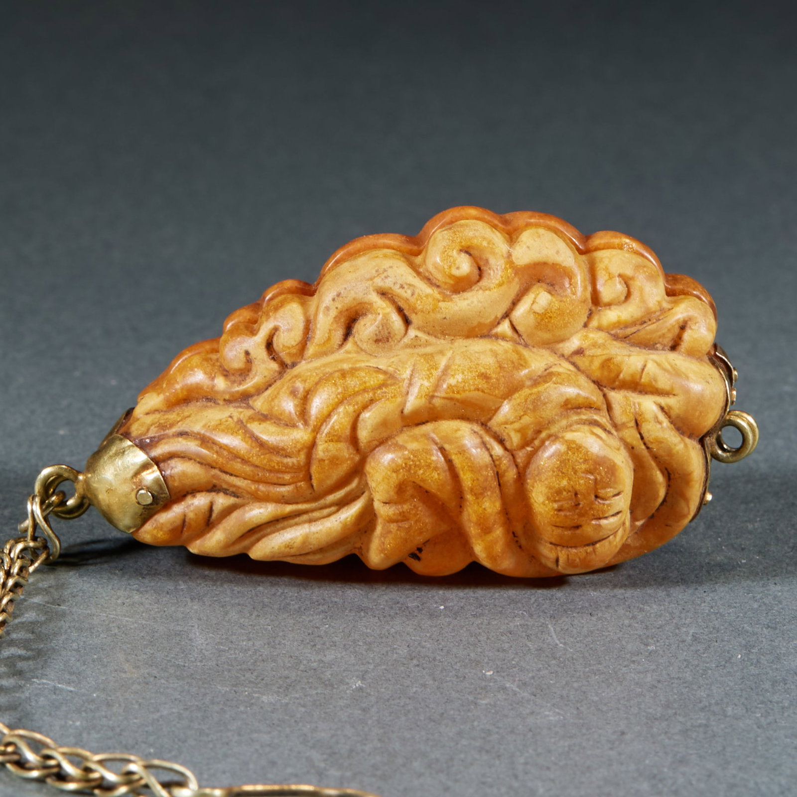 Amber Flying Apsaras Sachet: Amber Flying Apsaras Sachet: Made of amber round carved with flying apsaras statue stretching gracefully with flowing robe lines, compact sachet shape; Height 5.2cm, length 2.5cm, width 2.1cm, weight