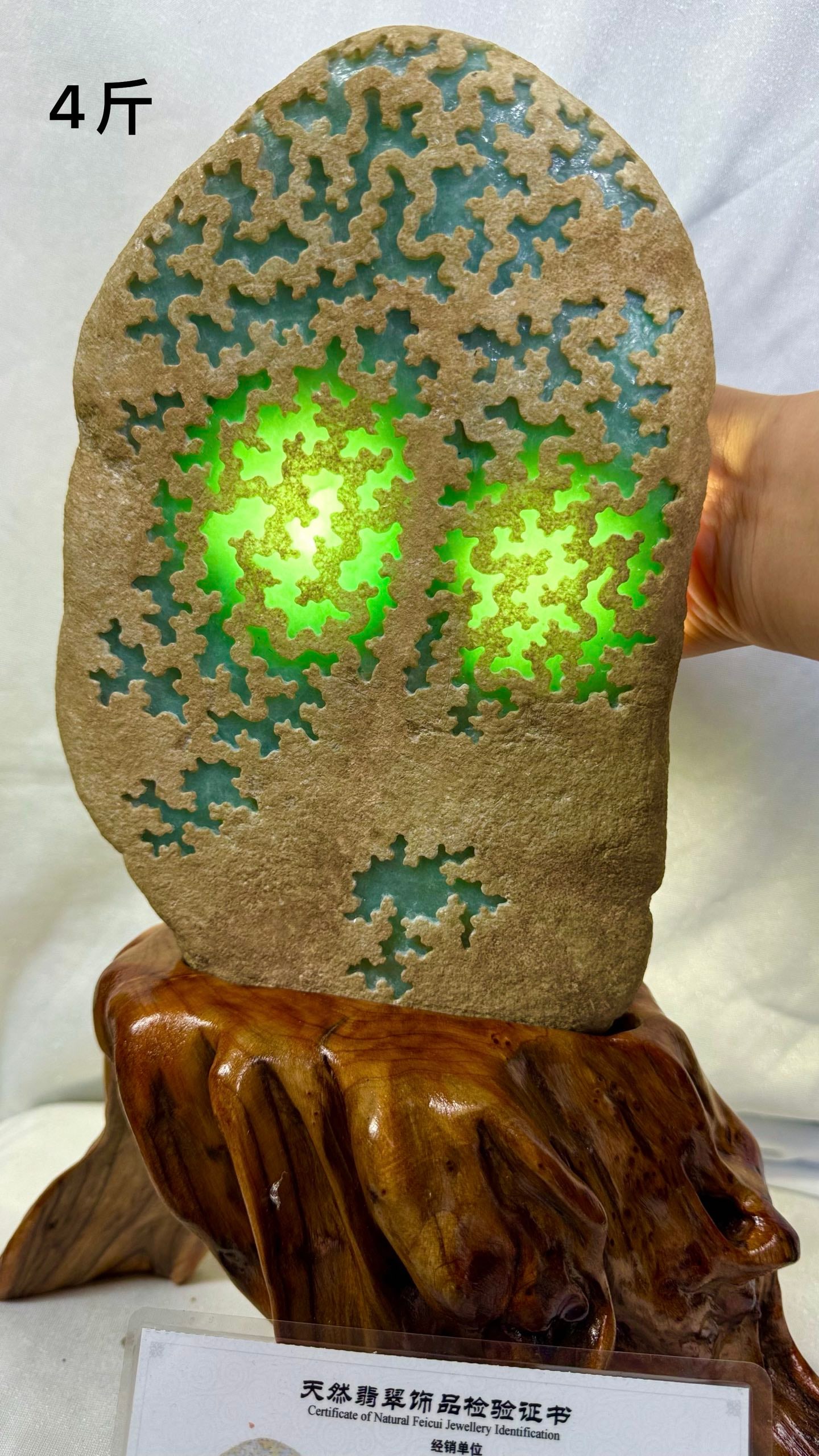 High-Ice Full Green Jadeite Rough Stone With Certificate: Certified High-Ice Full-Green Jadeite Rough Stone: Natural jadeite rough stone revealing high-ice full-green quality at the window, transparent water head, rich color and fine carving, attached with o