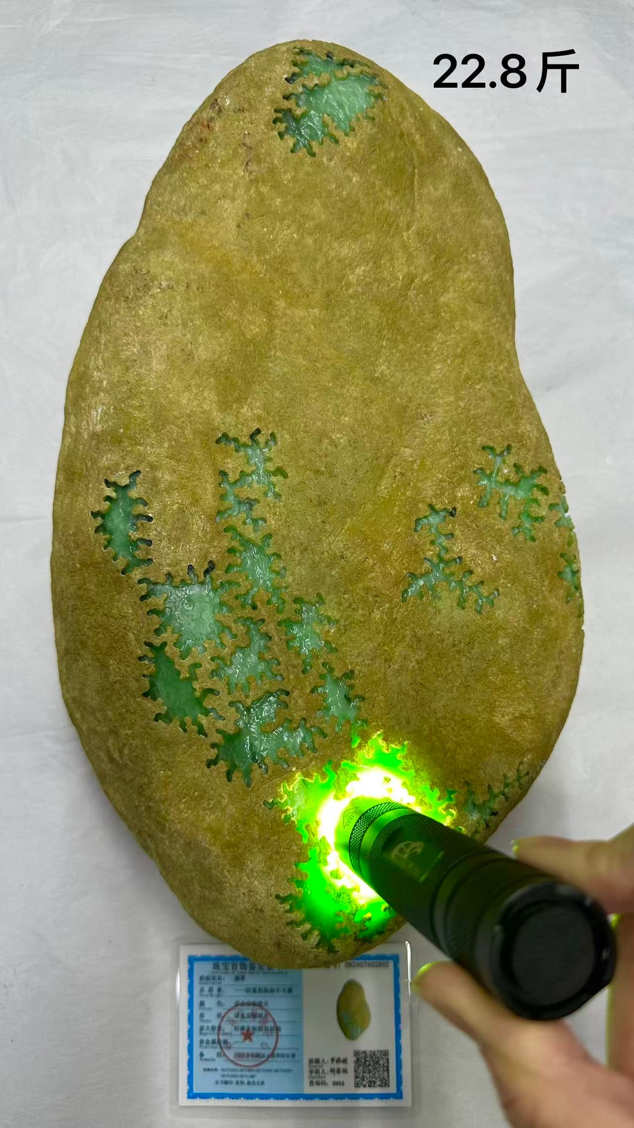 Jadeite Rough Stone: Jadeite Rough Stone: Natural jadeite rough stone presenting bright emerald green texture at the window, transparent water head, vivid color and fine carving, attached with certificate; Height approx 3