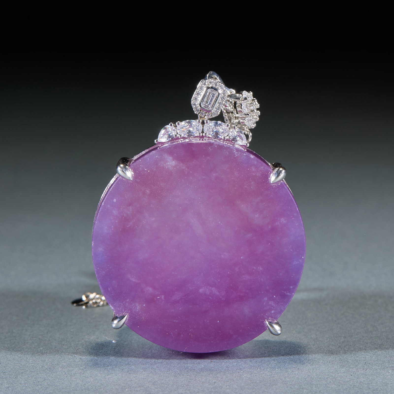 Violet Jadeite Plain Plaque, Sterling Silver Mount: Violet Plain Plaque Pendant: Natural round violet jadeite plaque with rich even color, mild transparent texture and plain uncarved surface, framed with sterling silver diamond-inlaid base and diamond