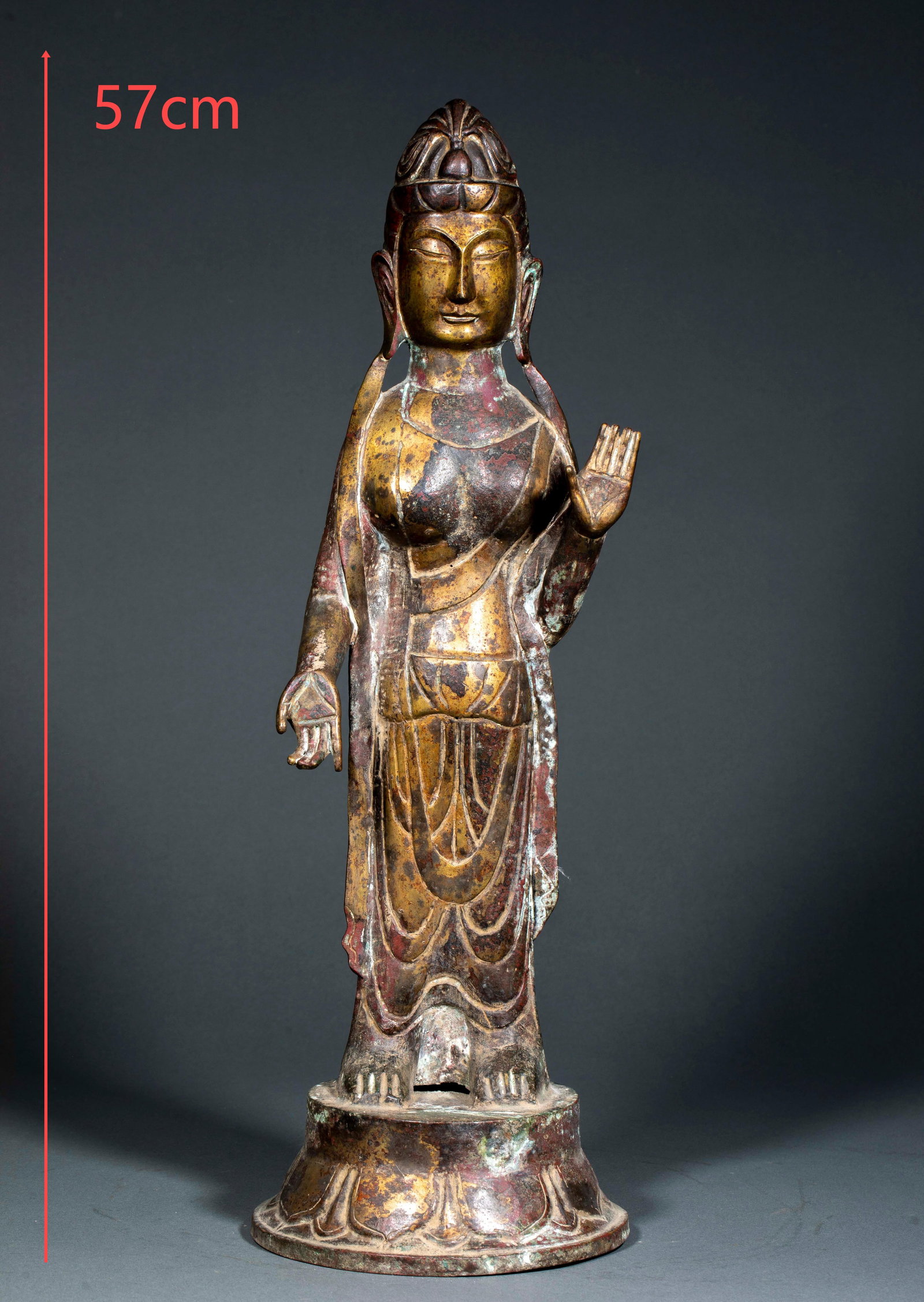 Standing Guanyin Statue, Northern Wei Dynasty (Pre-Ming Period): Gilt Bronze Standing Guanyin Statue, Northern Wei Dynasty. The bronze body is fully gilded; the Bodhisattva stands on a lotus throne, presenting the Varada and Abhaya mudras, draped in wide flowing