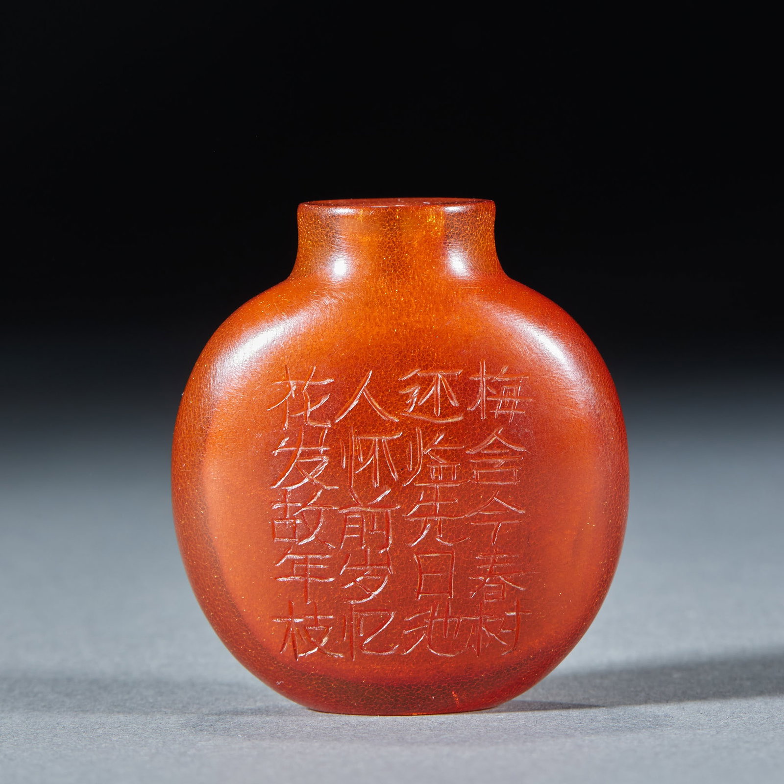 Amber Snuff Bottle with Plum Blossom and Poetry: Antique Amber Flat Snuff Bottle with Plum Blossom Poetry. Transparent full amber covered with ice crackle, outer wall incised with plum blossom odes, smooth petite shape. Overall height: 5cm, Length 4