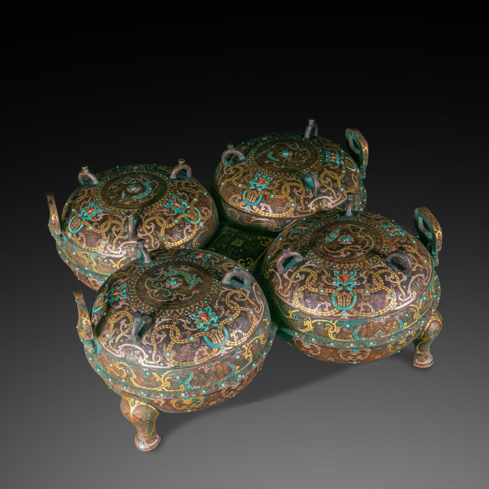 Pre-Ming Gold-Silver Inlaid Quadruple Ding Cauldron with Turquoise Inlay: Warring States-Han Gold-Silver Inlaid Quadruple Ding Cauldron with Turquoise Inlay Overall height 23.5cm, length 60cm, width 58cm. Cast in bronze into a connected quadruple ding shape, with coiled