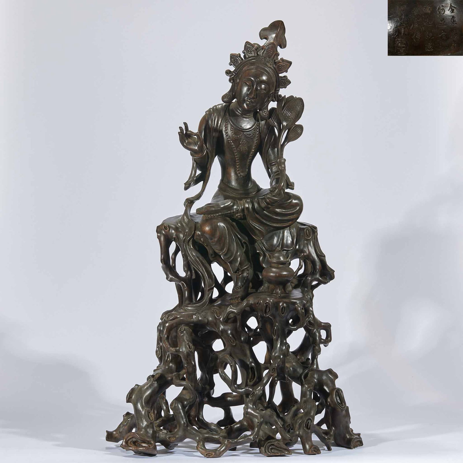 Agarwood Guanyin Holding Lotus: Large Natural Agarwood Hollow Statue of Guanyin Holding Lotus Overall height 83cm, length 45cm, width 33cm. Carved integrally from a single large piece of agarwood, Guanyin sits freely on a hollow dea