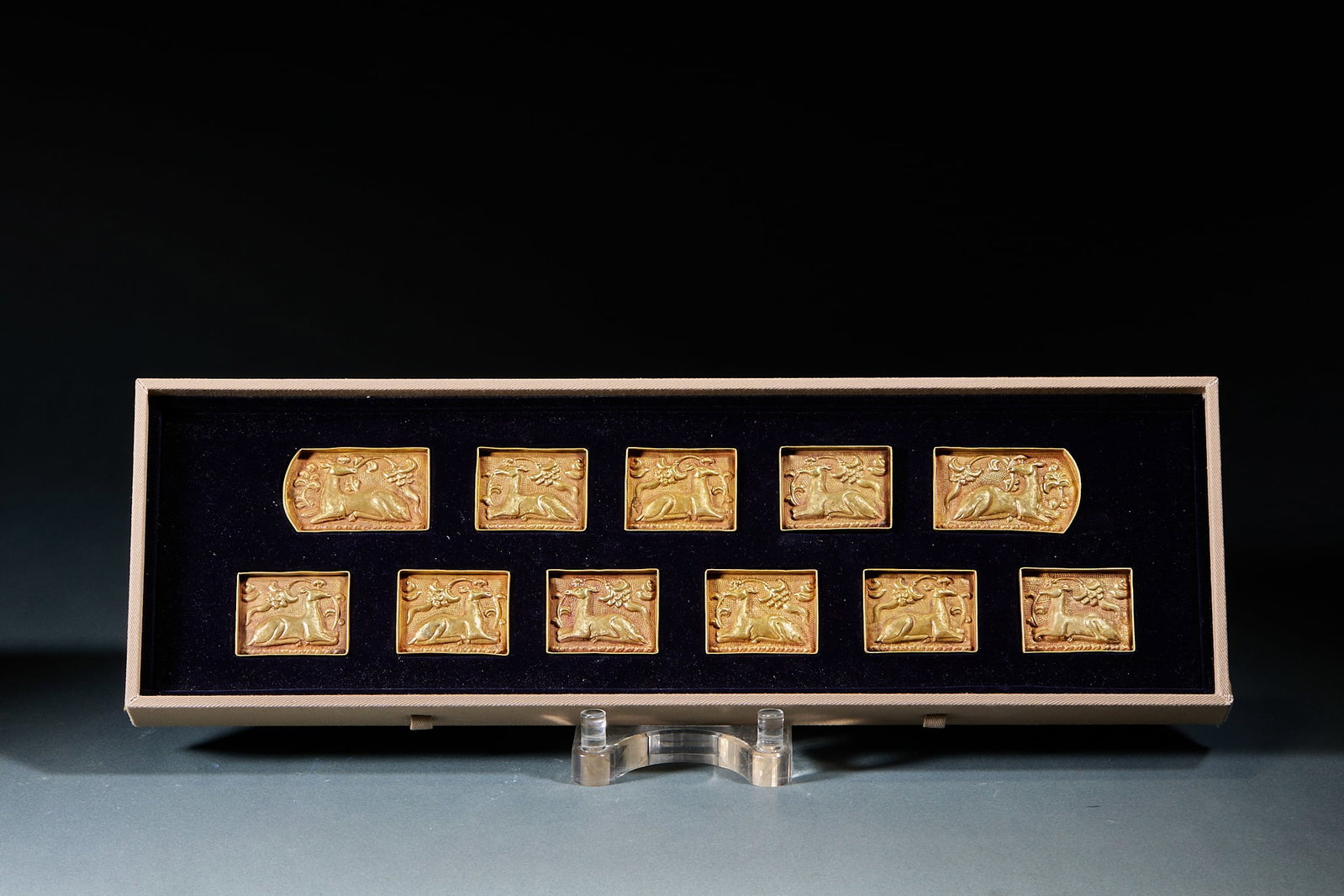 Set of Pure Gold Deer Pattern Belt Plaques: Complete Set of Twelve Pure Gold Belt Plaques with Deer Motifs Each plaque is molded with reclining deer and ganoderma patterns, uniform in shape and form, stored in an original brocade box. Single pl