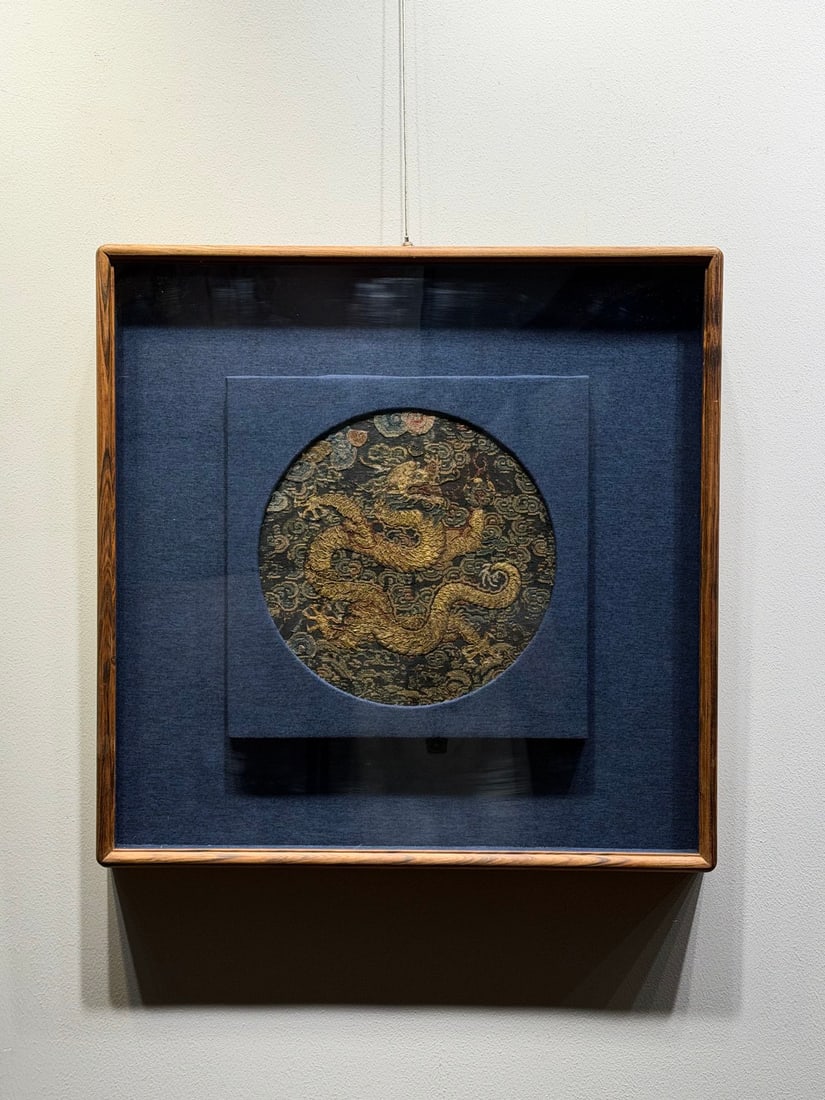 Mid-Qing Gold Thread Embroidered Dragon Rank Badge: Mid-Qing Round Rank Badge with Gold-Thread Five-Claw Dragon on Black Ground Five-claw dragons winding among auspicious clouds are formed with coiled gold threads, presenting a steady color tone, mount