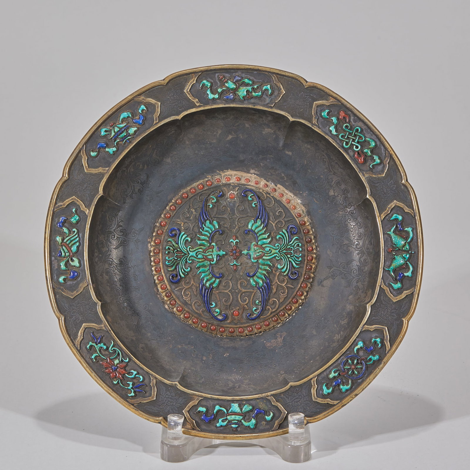 Gilt Silver Plate with Turquoise Inlay and Double Phoenix Motif: Gilt Silver Dish with Double Phoenix and Eight Treasures Motif, Turquoise Inlay, of silver body with gilt rim, the lobed rim reserved panels carved with Buddhist eight treasures patterns, inlaid with 