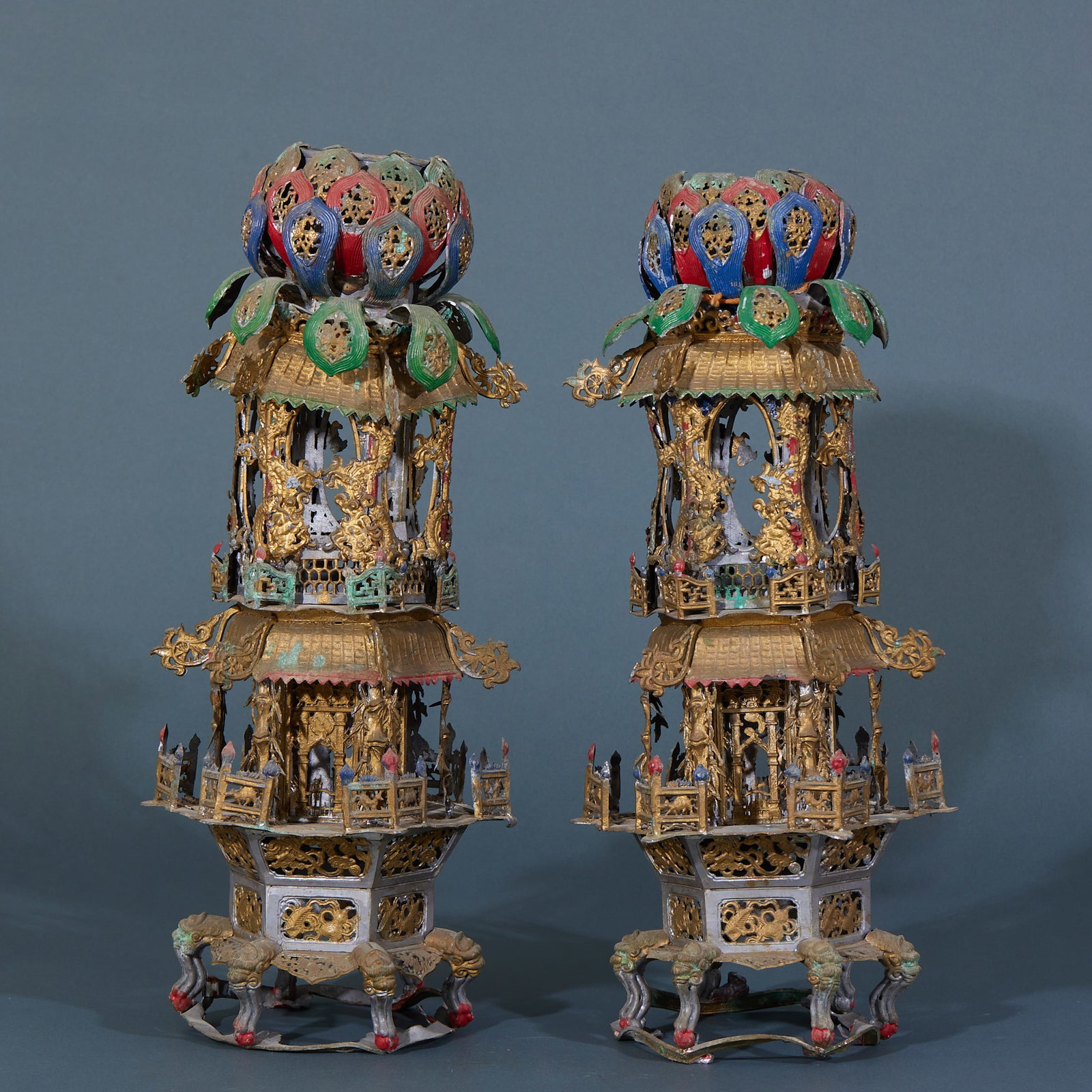 Pair of Pewter Candlesticks with Floral Motifs: Pair of Pewter Painted Pavilion-Style Buddhist Pagodas, with pewter base, crafted with chiseling, openwork, gilding and mineral color decoration techniques, shaped from top to bottom with lotus
