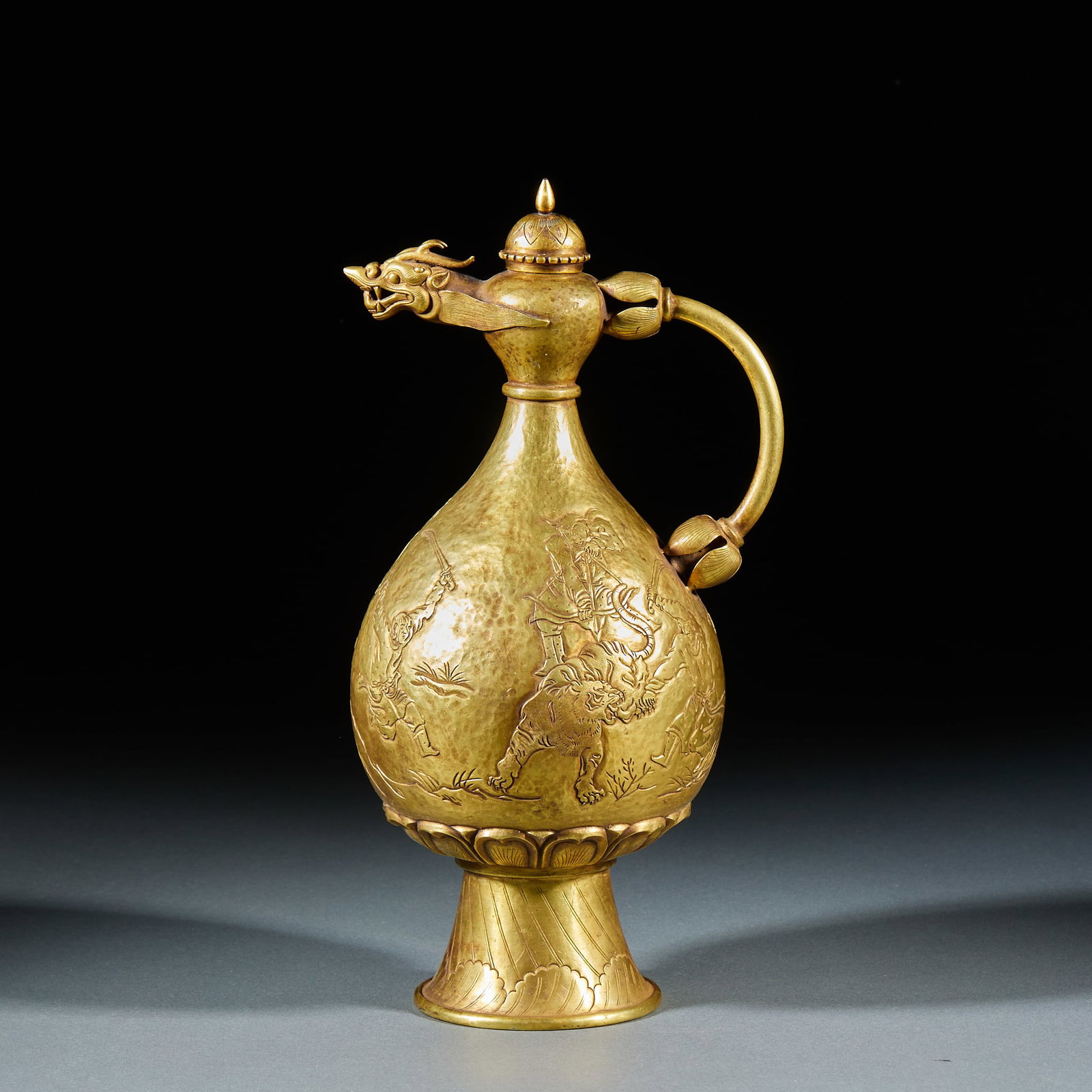 Gold Ewer with Hunting Scene and Dragon-Head Spout: Gold Ewer with Hunting Scene and Dragon Head Spout, hammered and formed as a whole, the spout shaped into a dragon head, the handle in lotus bud form, the belly chiseled with hunting scenes with vivid