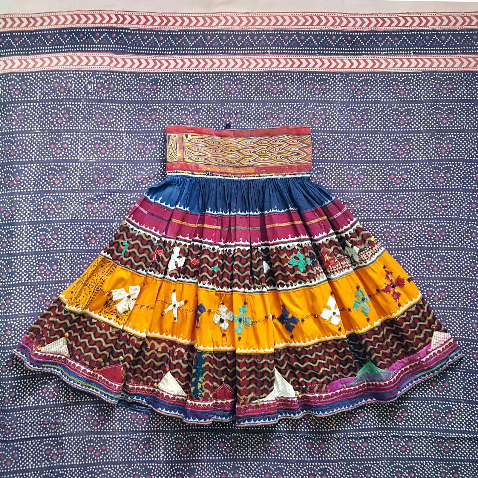 RARE Vintage 1960s Handmade Ethnic Embellished + Embroidered Full Skirt: Style #: V3PSKW191 Label: Not Available Manufactured: India Fabric: Cotton with Rayon or Silk EmbroideryColor: Maroon | Orange | Blue | Multi Condition: Very Good Used Vintage Size: Approx S-M Waistba