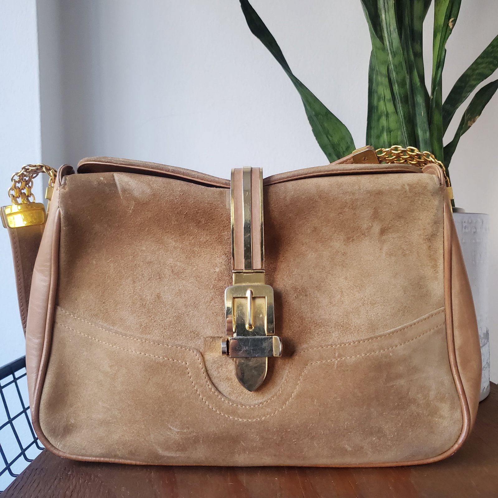 RARE Vintage 1990s NEIMAN MARCUS Italian Metal Belt Closure Shoulder Bag (Reserve $30): Style #: V3PBGW593 Label: NEIMAN MARCUS Manufactured: Italy Material: Suede | Leather Color: Light Camel Condition: Very Good Used Vintage Height: 7 1/2" Width: 10 1/2" Depth: 2 1/2" Strap Length: 26"