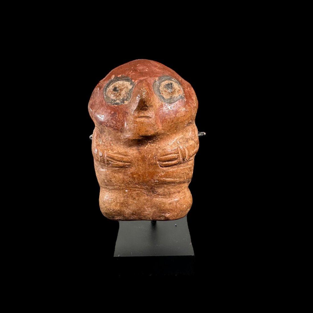Pre-Columbian Moche-Huari painted figure: Pre-Columbian Moche-Huari painted figure from the North Coast of Peru, ca. 600-800 CE. Small painted figure in red, orange, and black. Stand included. 3" height. Estate of P. Arnovick, Sold by J. T. D