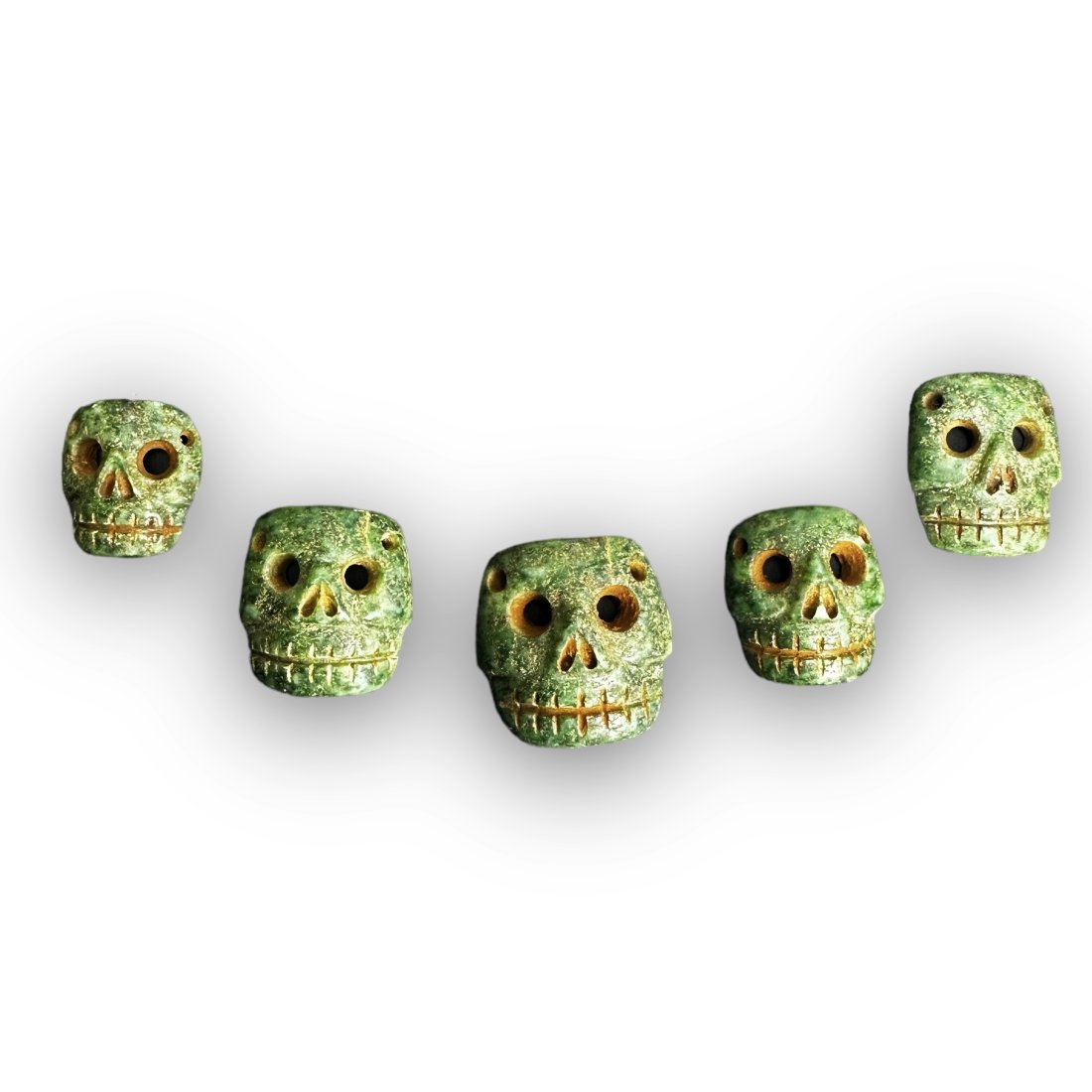 Pre-Columbian Mixtec, Aztec green stone skull pendants (1 of 2)