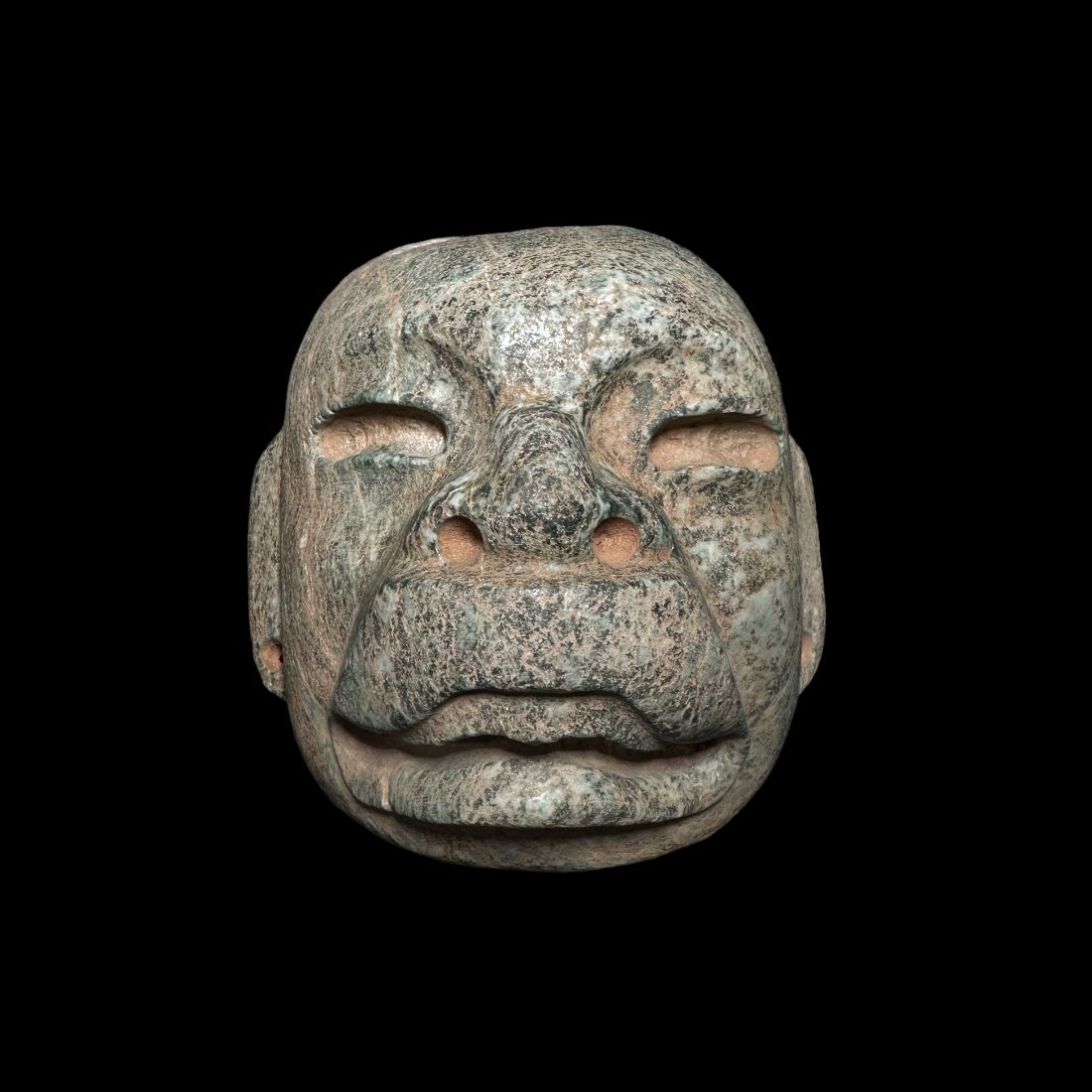 Pre-Columbian Olmec green stone mask: Pre-Columbian Olmec green stone mask from Mexico, ca. 300-100 BCE. A fantastic carved mask with were jaguar mouth and perforated holes for suspension. 4-5/8" height. Ex. private Texas collection acqui