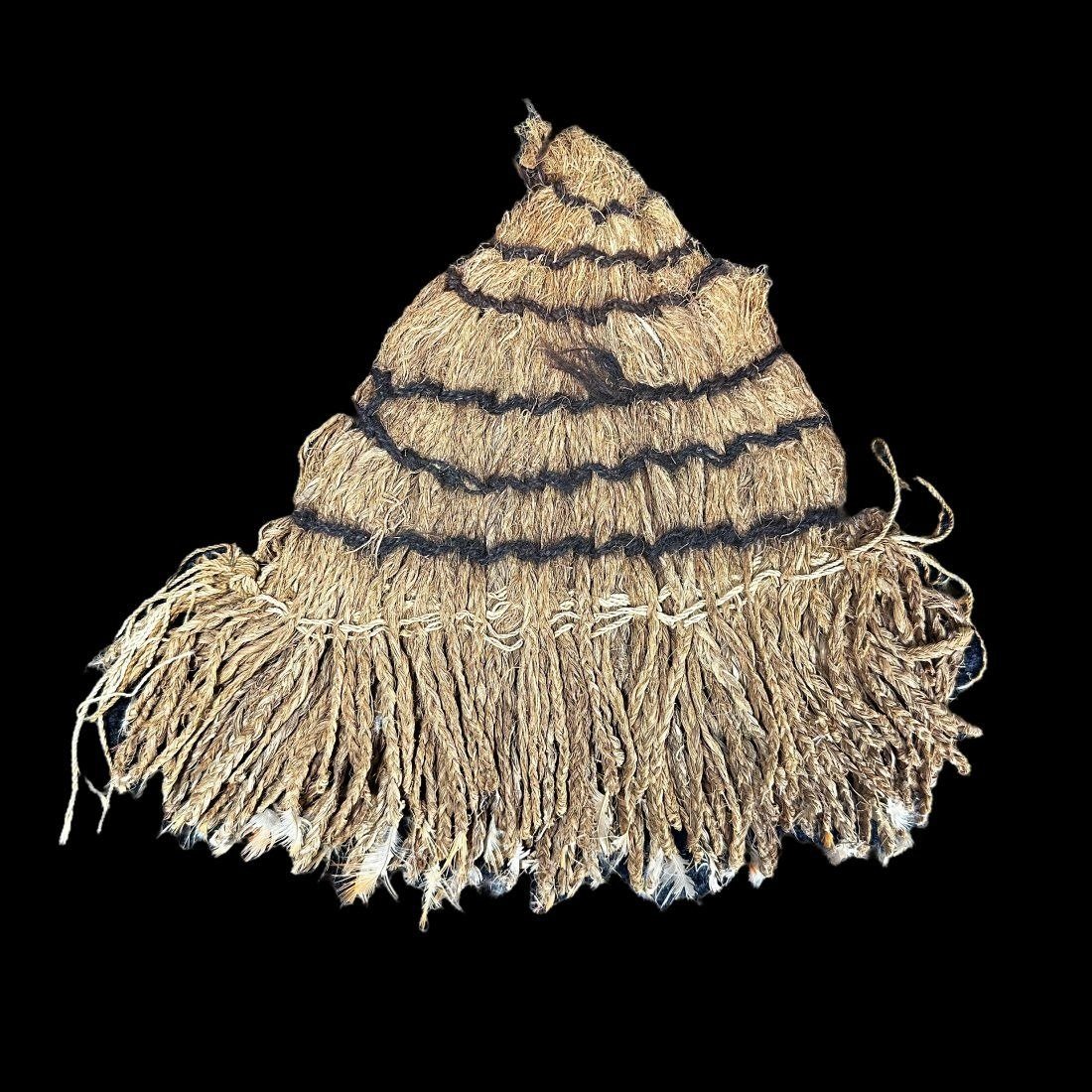 Pre-Columbian Nazca Feather Fan: Pre-Columbian Feather Fan from Peru, ca. 100-600 CE. fan is composed of vegetal fibers provided with twisted cord into which feathers were inserted. Small remains of feathers left on the fan (pictured