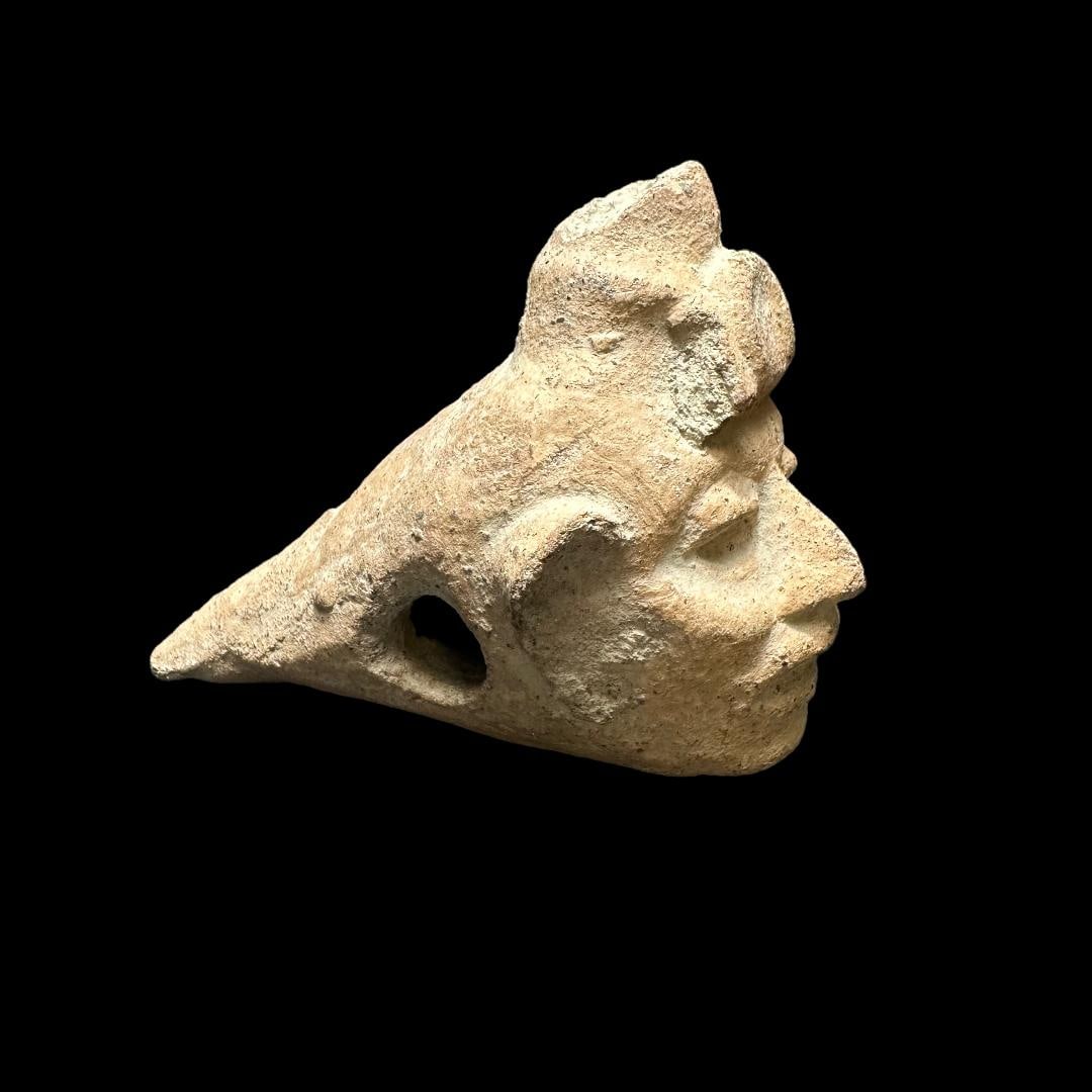 Rare Pre-Columbian Mixtec/Aztec pottery fish form: Unusual effigy in the form of a fish with a human face, Aztec or Mixtec culture, Valley of Mexico or Oaxaca State, Mexico, CE 900-1500, buff earthenware, mold made and modeled elements. A hollow ware