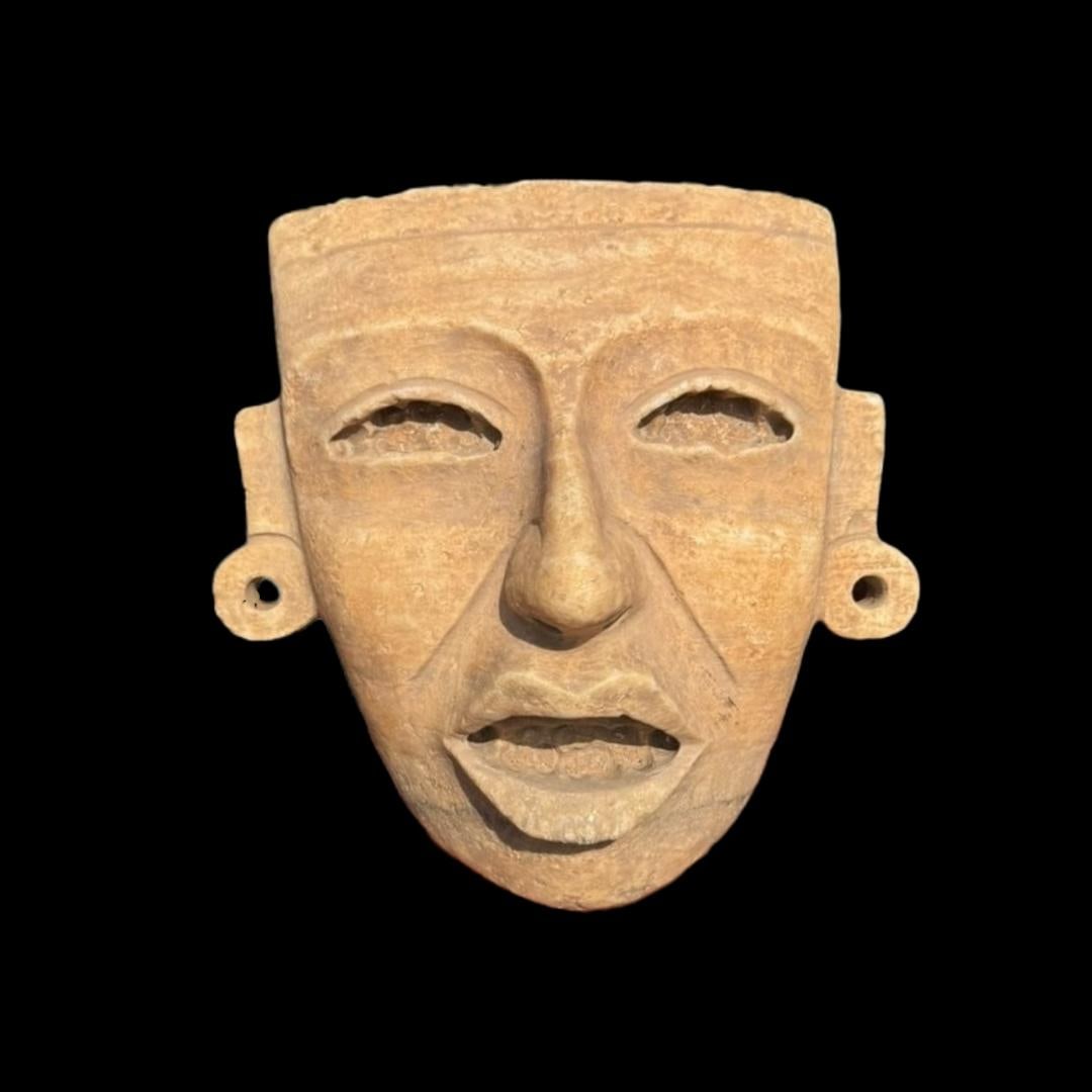 Pre-Columbian Teotihuacan alabaster mask: Pre-Columbian Teotihuacan alabaster mask. Mexico, circa 600-800 AD. Aquiline nose, almond-shaped eyes under thinly arched brows, rectangular ears with ear ornaments. The back of the mask shows ancient