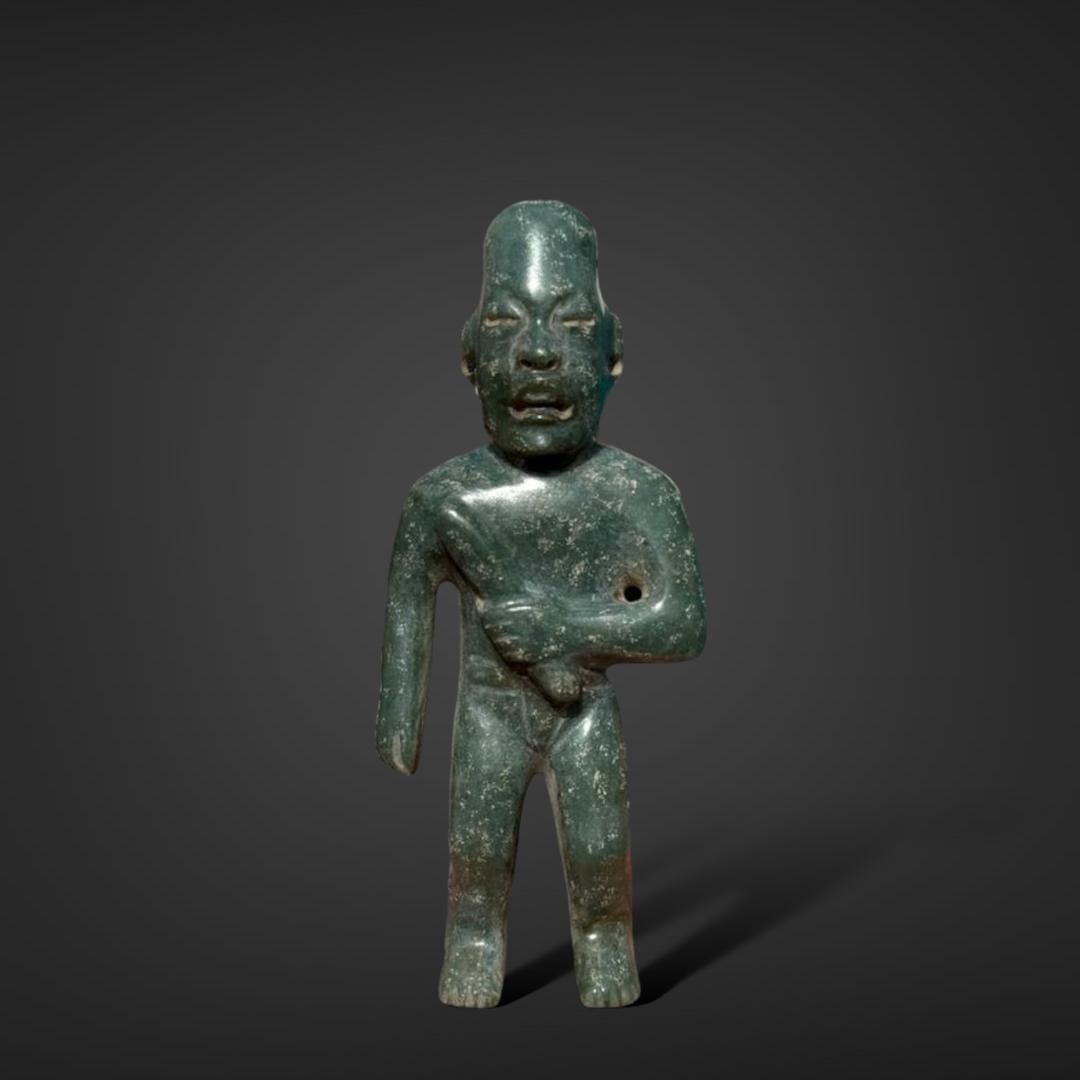 Pre-Columbian Olmec jade figure holding celt (1 of 4)