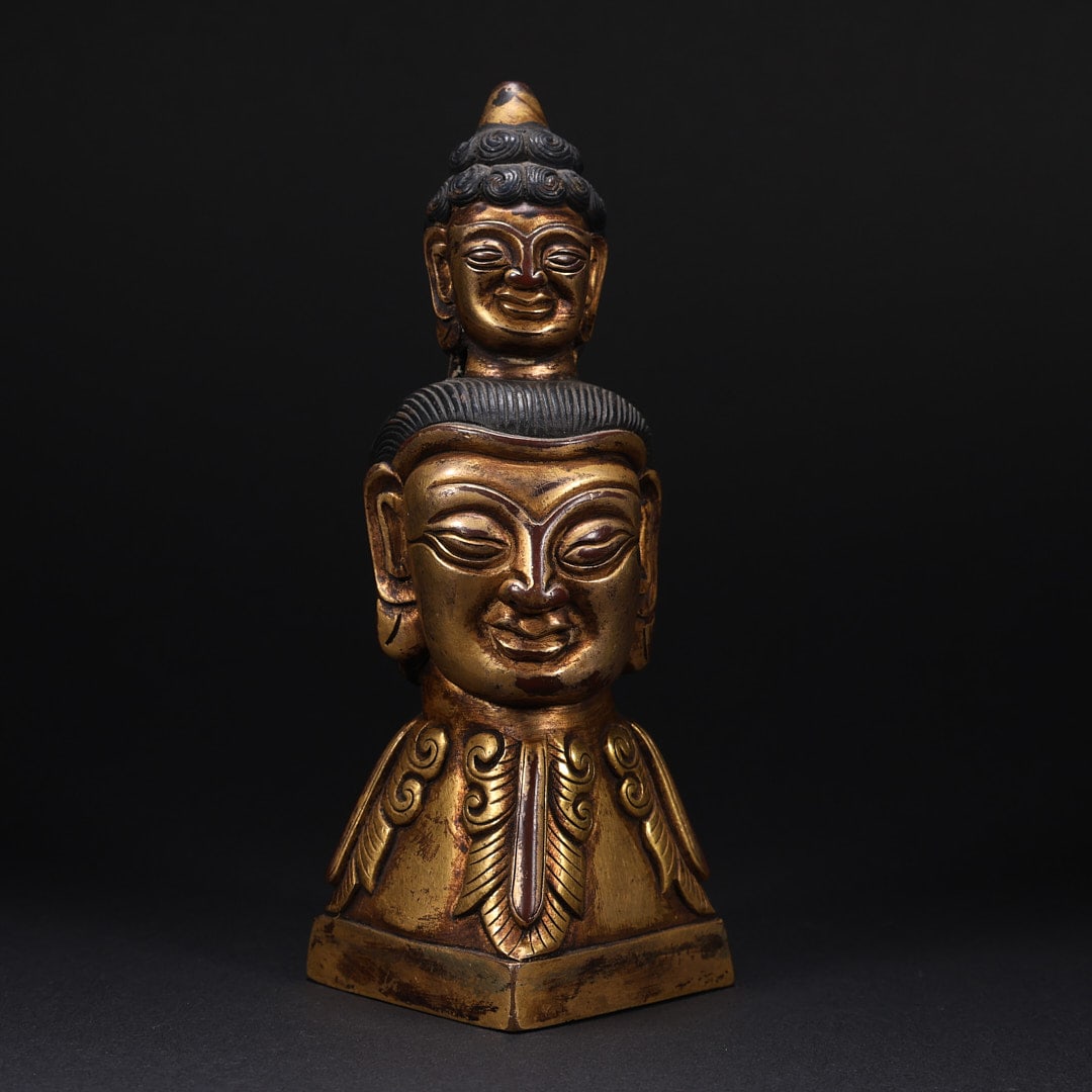 A gilded double-headed copper Buddha statue from the Ming Dynasty