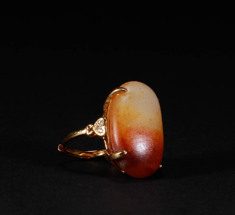 A gilded copper ring inlaid with Hetian jade: Height: 3.2cm, width:2.8 cm