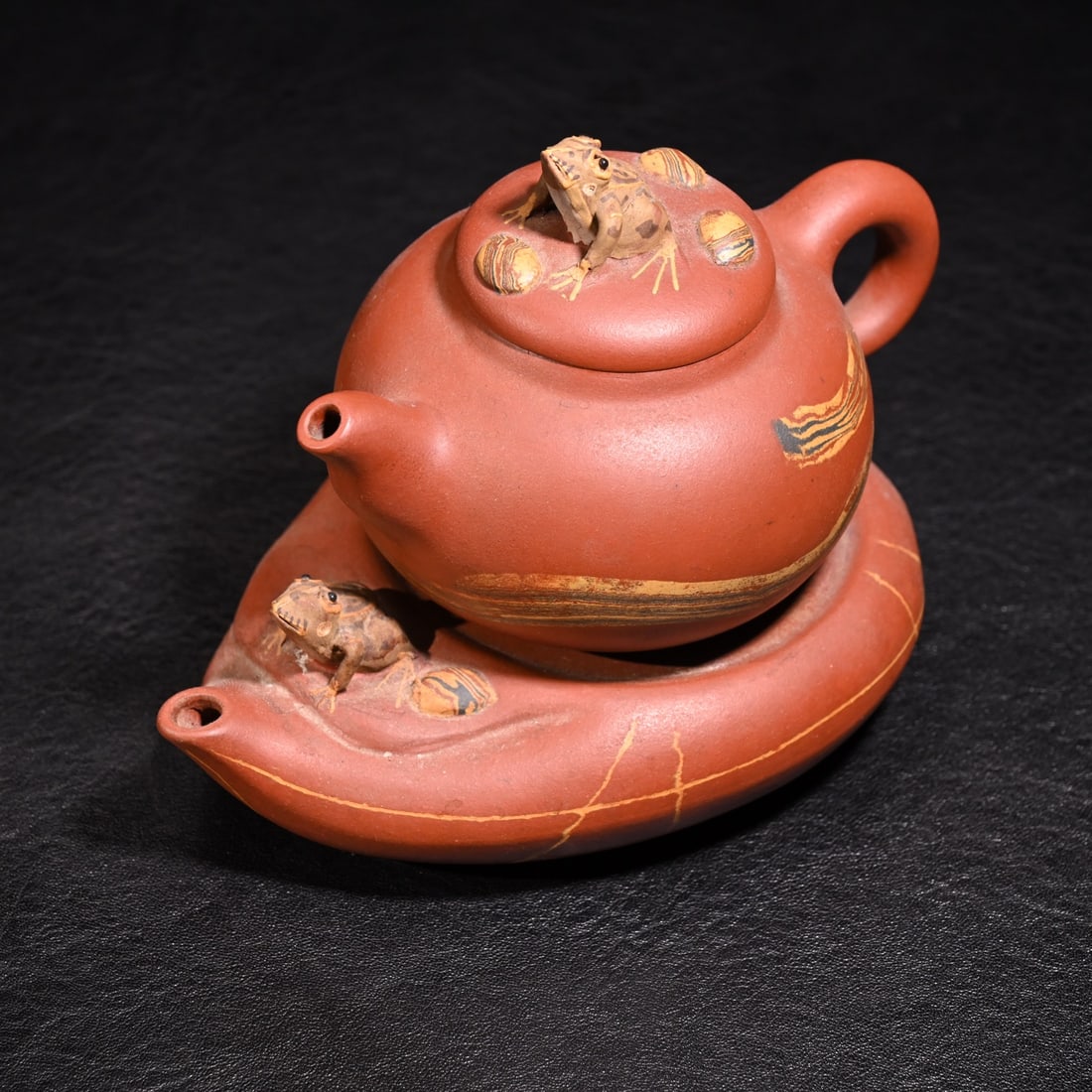 Purple clay teapot: Height: 8cm, width:12 cm