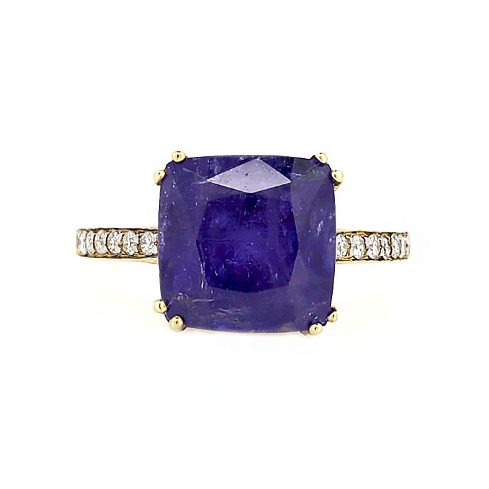 14CT Yellow Gold Tanzanite And Diamond Dress Ring: A 14ct yellow gold Tanzanite and diamond dress ring. Features one 6.43ct cushion cut Tanzanite and twelve round brilliant cut diamonds at 0.14ct total diamond weight in J-L colour with SI-1 - P-1 clar