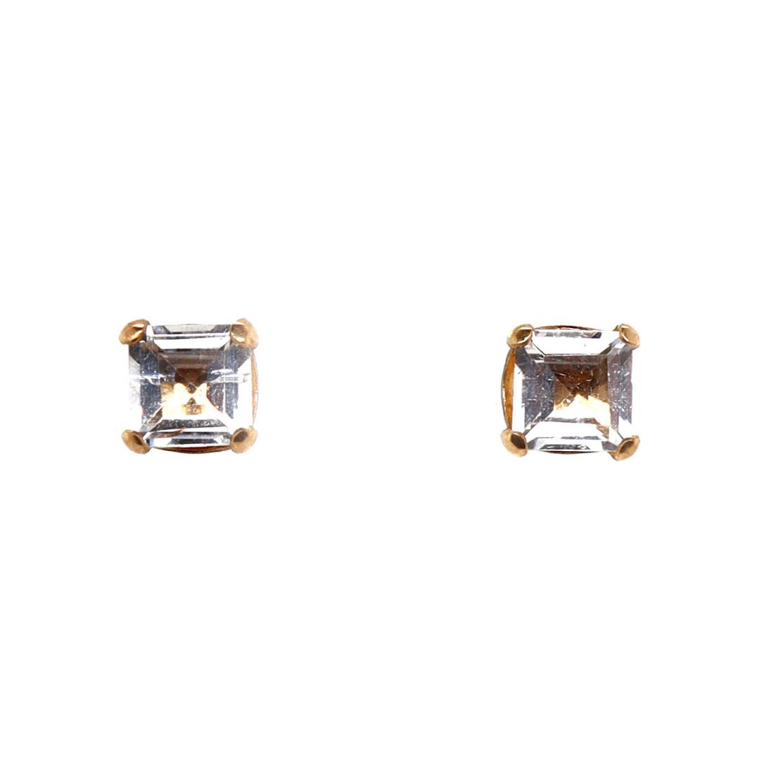 10CT Yellow Gold Clear Quartz Earrings: A pair of 10ct yellow gold clear Quartz earrings. Features two square cut clear Quartz. Measures at 5.5mm in length by 5mm in width and weight 0.66g. Secured by post backs with butterfly clasp closure