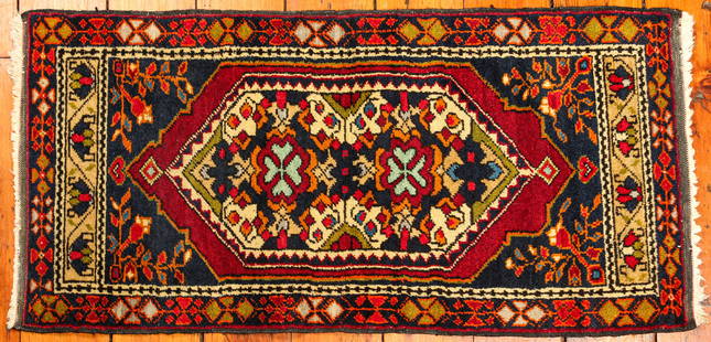 Hand Knotted Oriental Kazak Mat: Type: Rug Materials: Dyed wool Markings & Inscriptions: Unmarked Date: Mid to late 20th century Maker: Middle Eastern Description: A vintage hand knotted Kazak rug, mid to late 20th century. Dimension